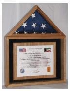 Elegant oak display case showcasing an American flag and certificate, perfect for honoring military service and achievements.