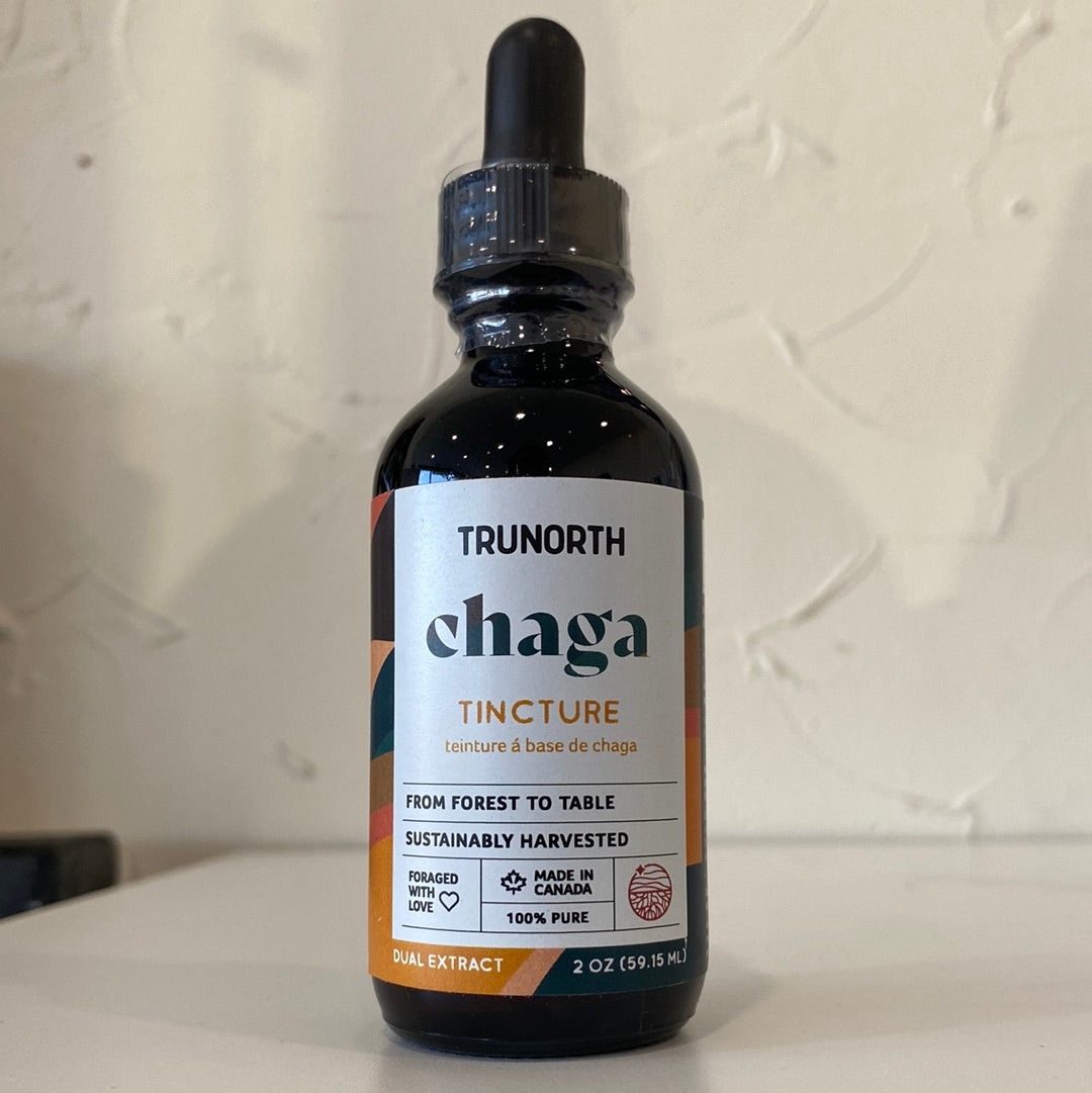 A 2oz bottle of Chaga Tincture Dual Extract with a dropper, showcasing its rich amber color.