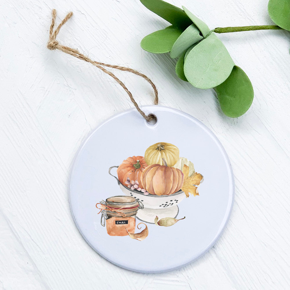 Chai Pumpkin Bowl ornament made of high-quality porcelain with a vibrant pumpkin design, perfect for holiday decor.