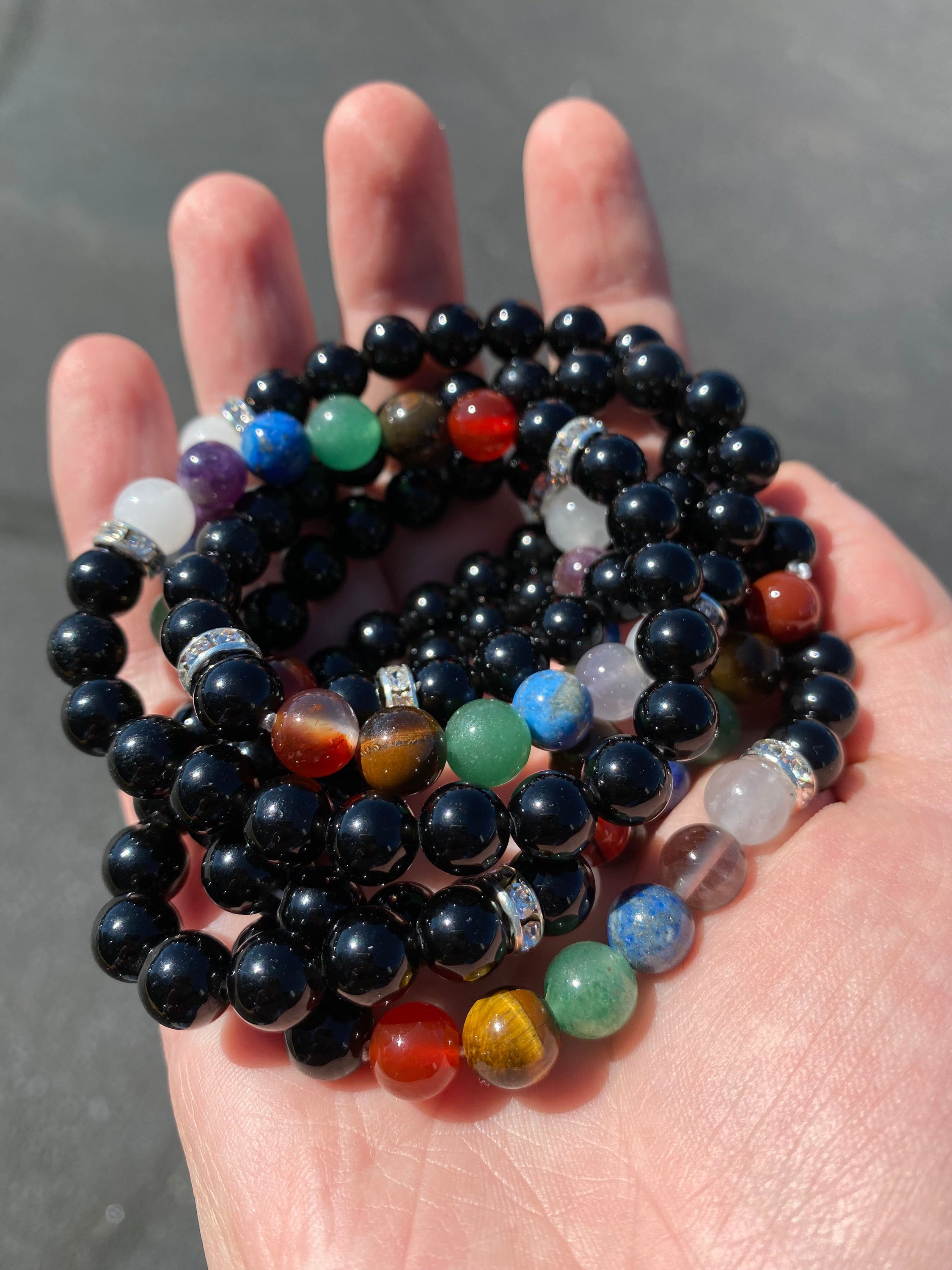 Chakra 8mm Bracelet featuring colorful crystals representing each chakra, elegantly designed for spiritual balance and healing.