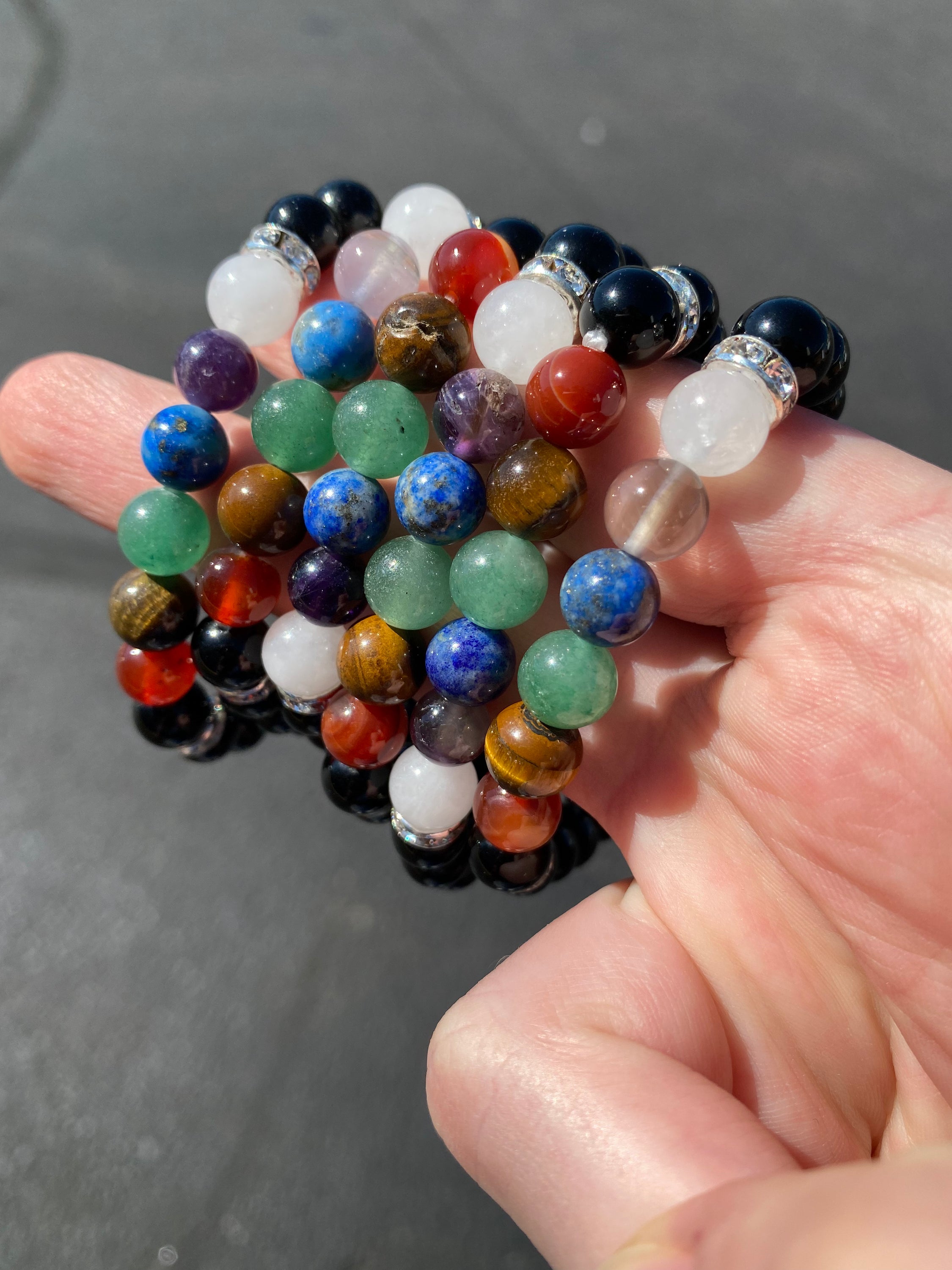 Chakra 8mm Bracelet featuring colorful crystals representing each chakra, elegantly designed for spiritual balance and healing.