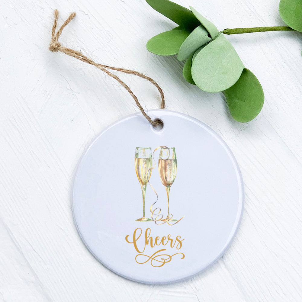 A beautifully crafted porcelain ornament featuring a Champagne Cheers design, perfect for gifting or decoration.