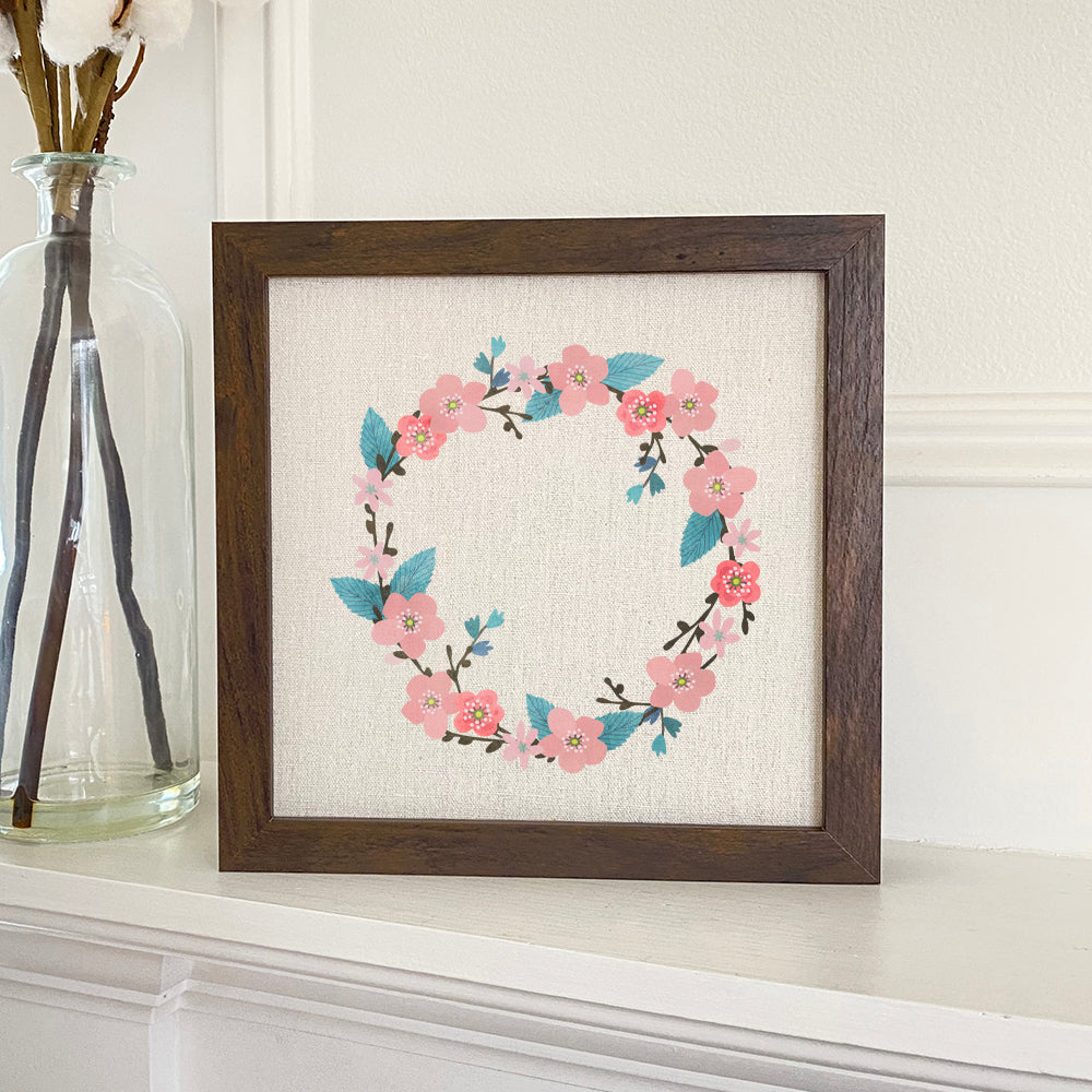 Cherry Blossom Wreath framed sign with a stylized design in a walnut frame, showcasing eco-friendly printing on a linen-look background.