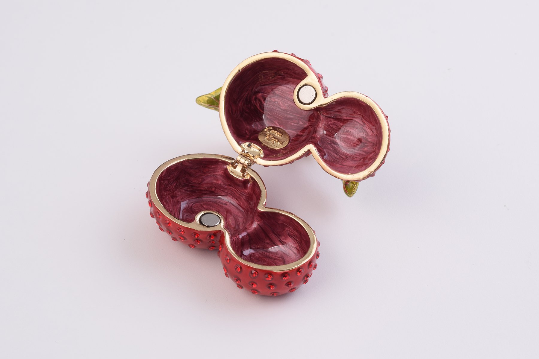 A beautifully handcrafted Cherry Trinket Box with enamel finish and Austrian crystals, featuring a secure magnetic closure and luxurious gold or silver plating.