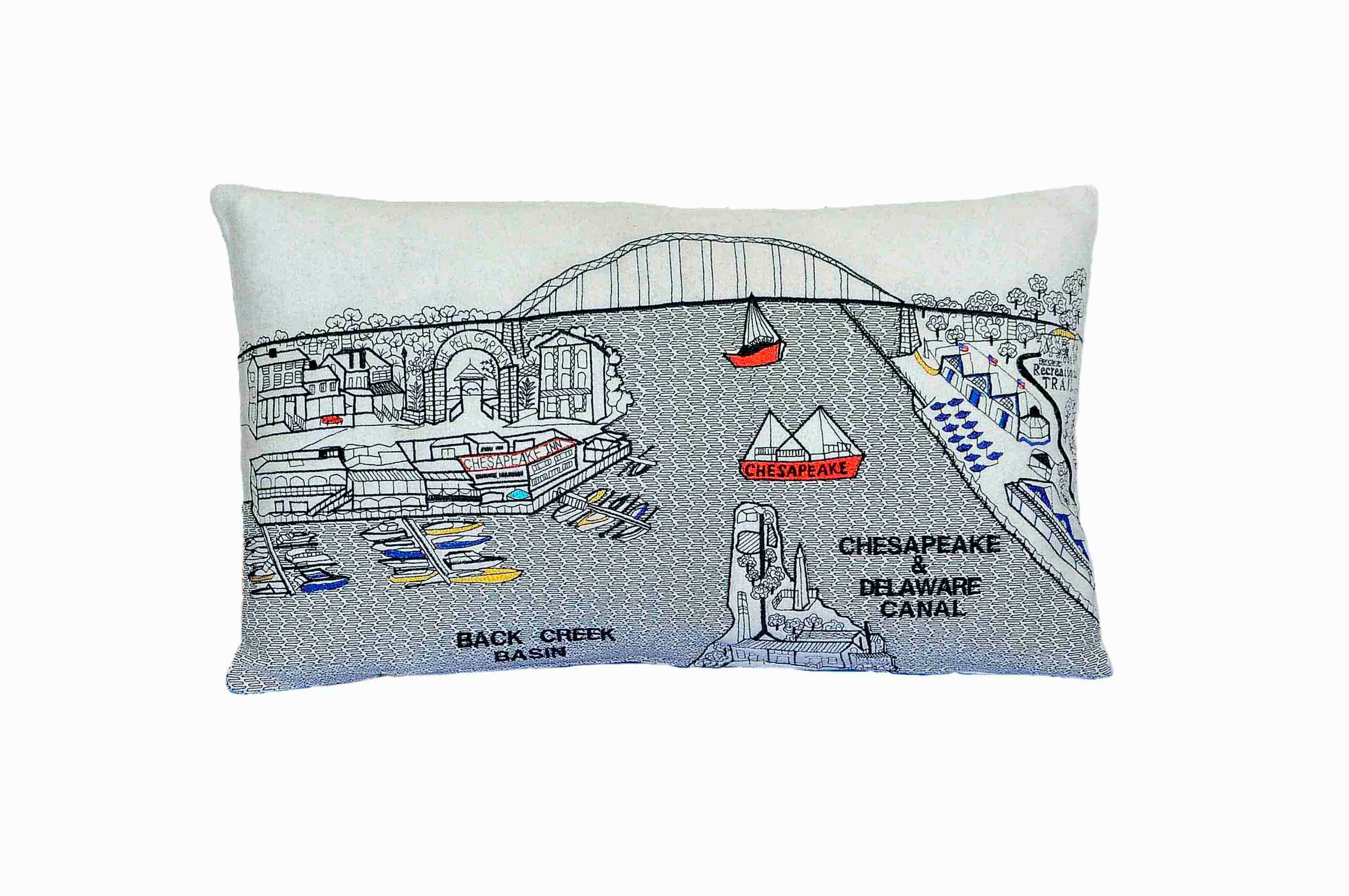 Chesapeake City Pillow showcasing vibrant colors and a unique design inspired by Maryland's historic charm, featuring a red zipper.