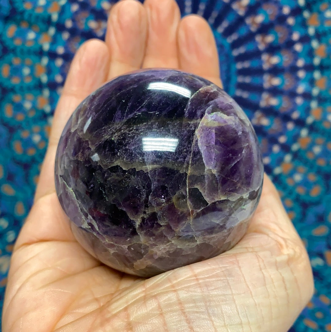 Chevron Amethyst Sphere #4, a 2.5-inch diameter crystal with banded purple and white patterns, weighing 385 grams.