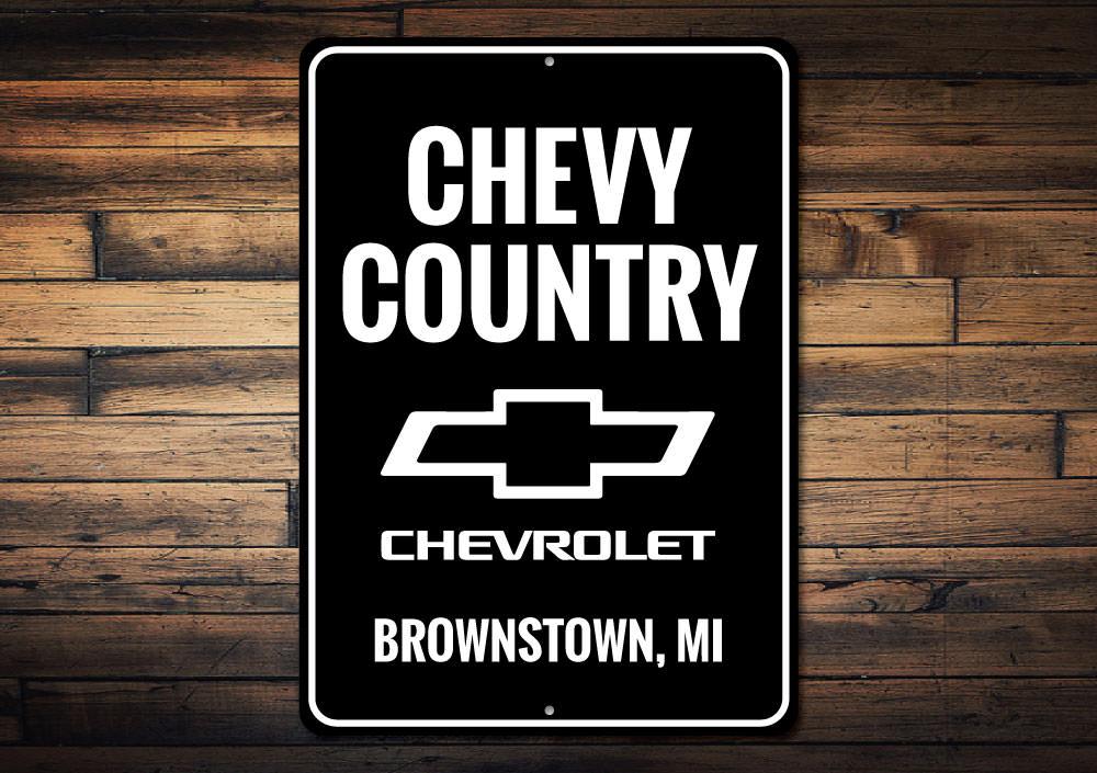 A vibrant Chevy Country Sign made of high-quality aluminum, featuring customizable text, perfect for garages and man caves.