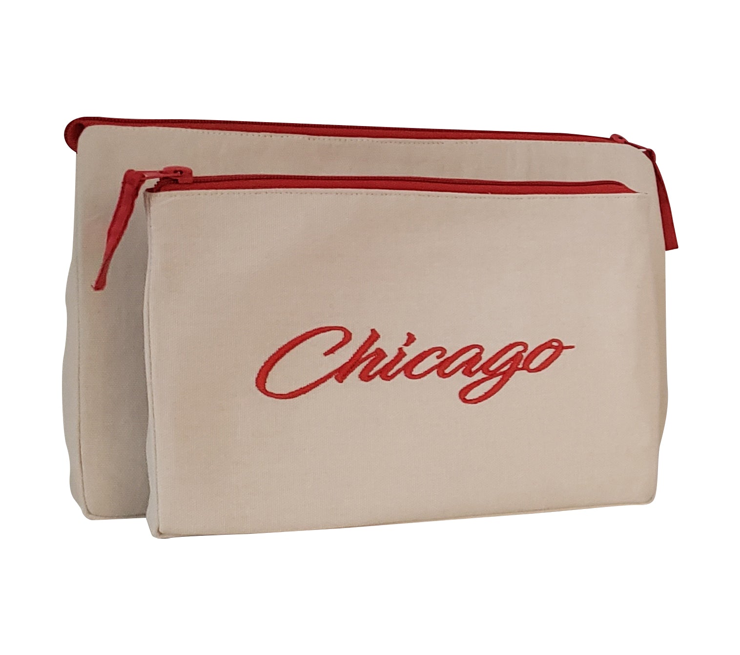 Chicago Makeup Bag set featuring embroidered skyline design on cream and black cotton canvas with red waterproof lining.