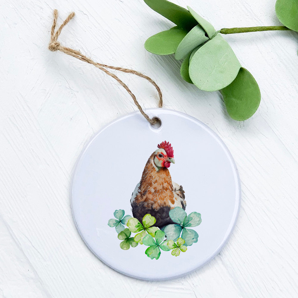 A beautifully crafted Chicken with Clovers porcelain ornament featuring vibrant colors and a glossy finish, perfect for home decor or gifting.