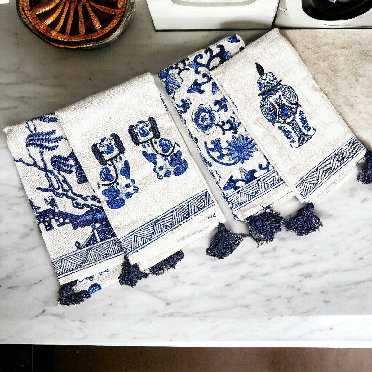 Beautiful Chinoiserie Tea Towels with blue and white embroidery and decorative tassels, showcasing their oversized design.