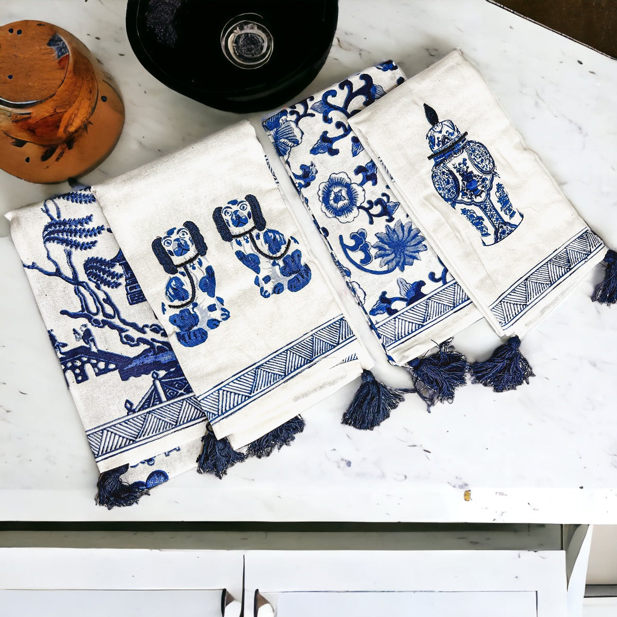 Beautiful Chinoiserie Tea Towels with blue and white embroidery and decorative tassels, showcasing their oversized design.