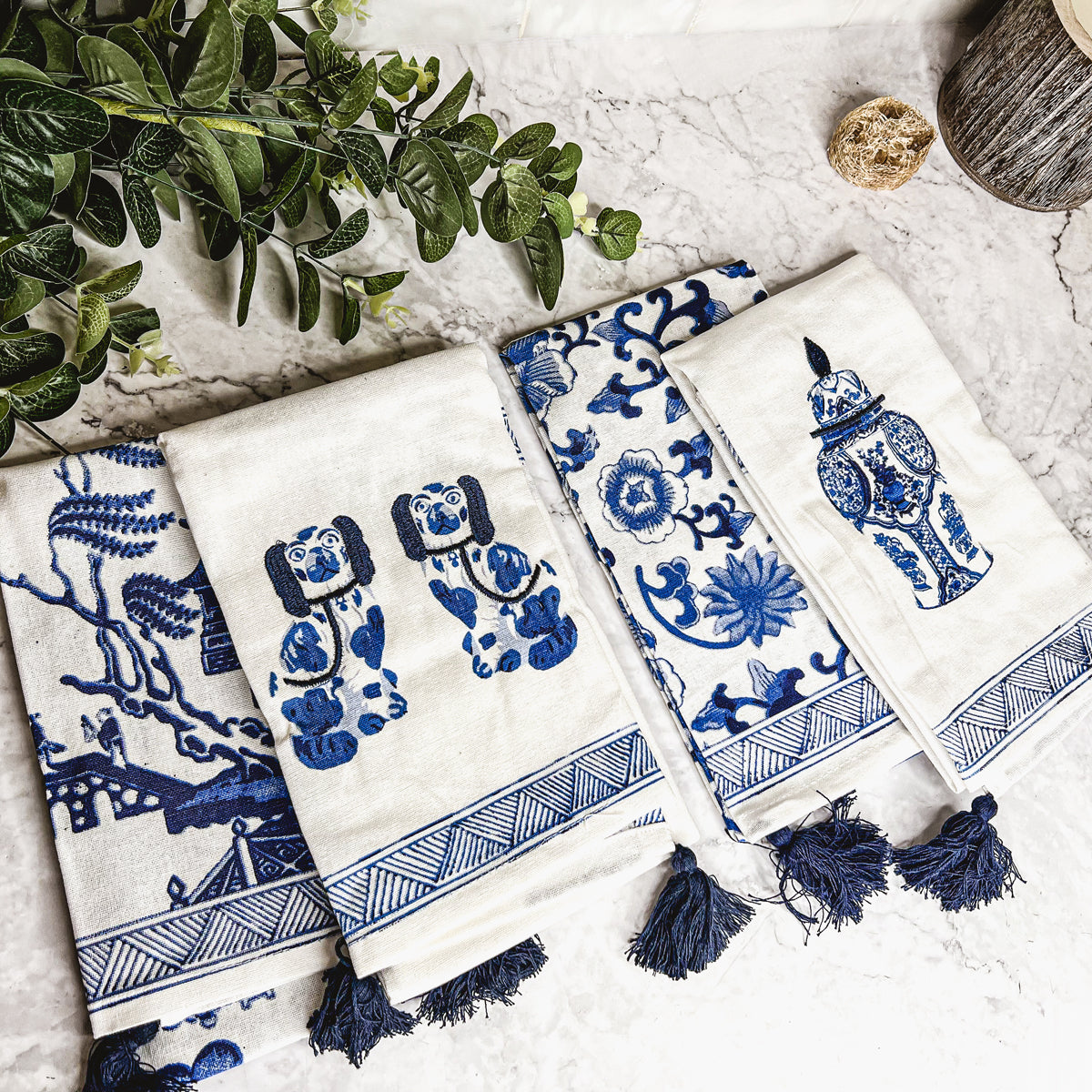 Beautiful Chinoiserie Tea Towels with blue and white embroidery and decorative tassels, showcasing their oversized design.