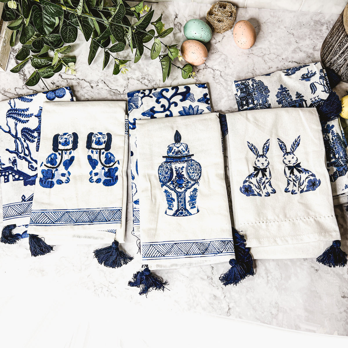 Beautiful Chinoiserie Tea Towels with blue and white embroidery and decorative tassels, showcasing their oversized design.