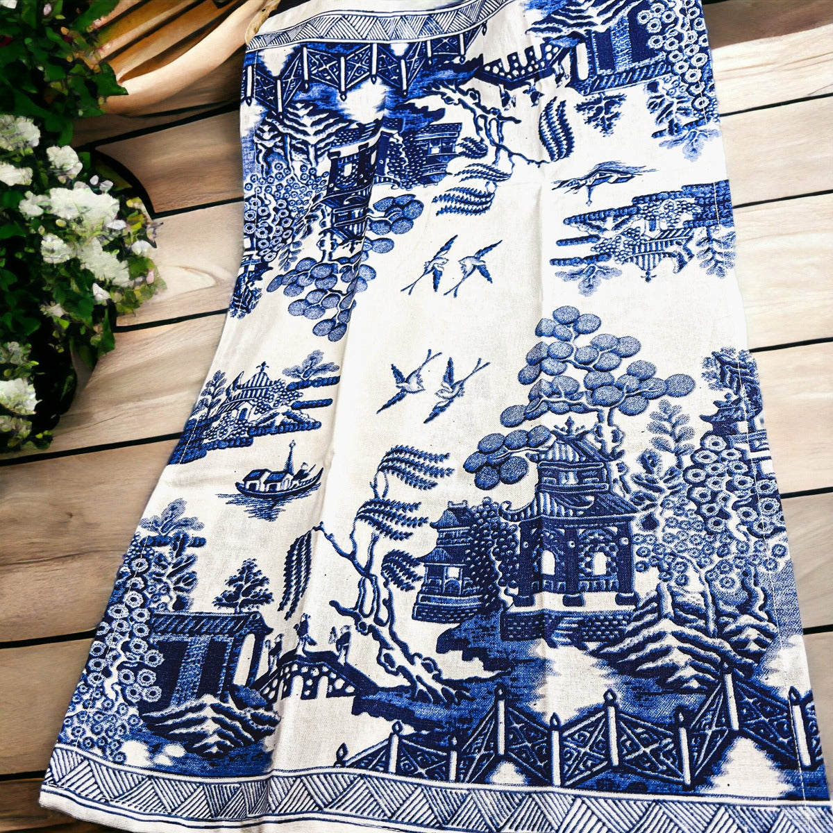 Beautiful Chinoiserie Tea Towels with blue and white embroidery and decorative tassels, showcasing their oversized design.