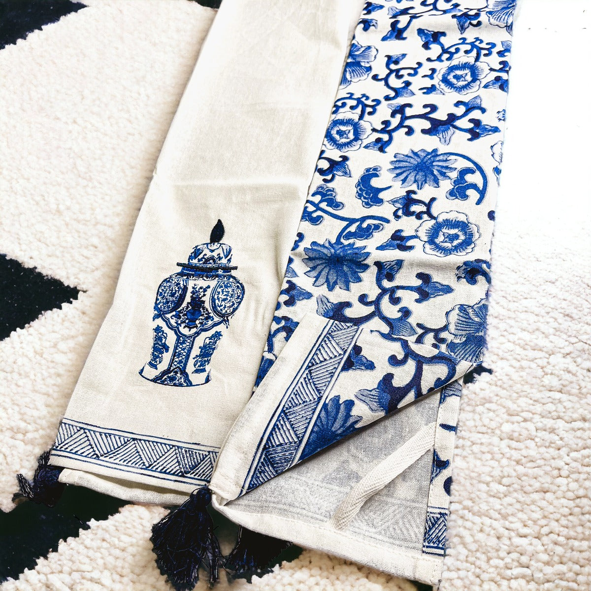 Beautiful Chinoiserie Tea Towels with blue and white embroidery and decorative tassels, showcasing their oversized design.