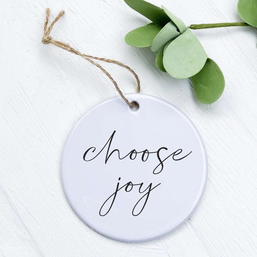 Choose Joy Ornament made of high-quality porcelain with a smooth, glossy finish, featuring original designs printed in vibrant colors.