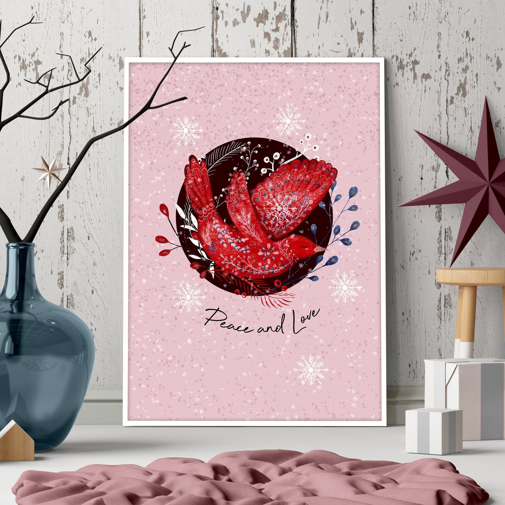 Scandi Christmas wall art print featuring a festive wreath and folk-style pigeon on a pink background.