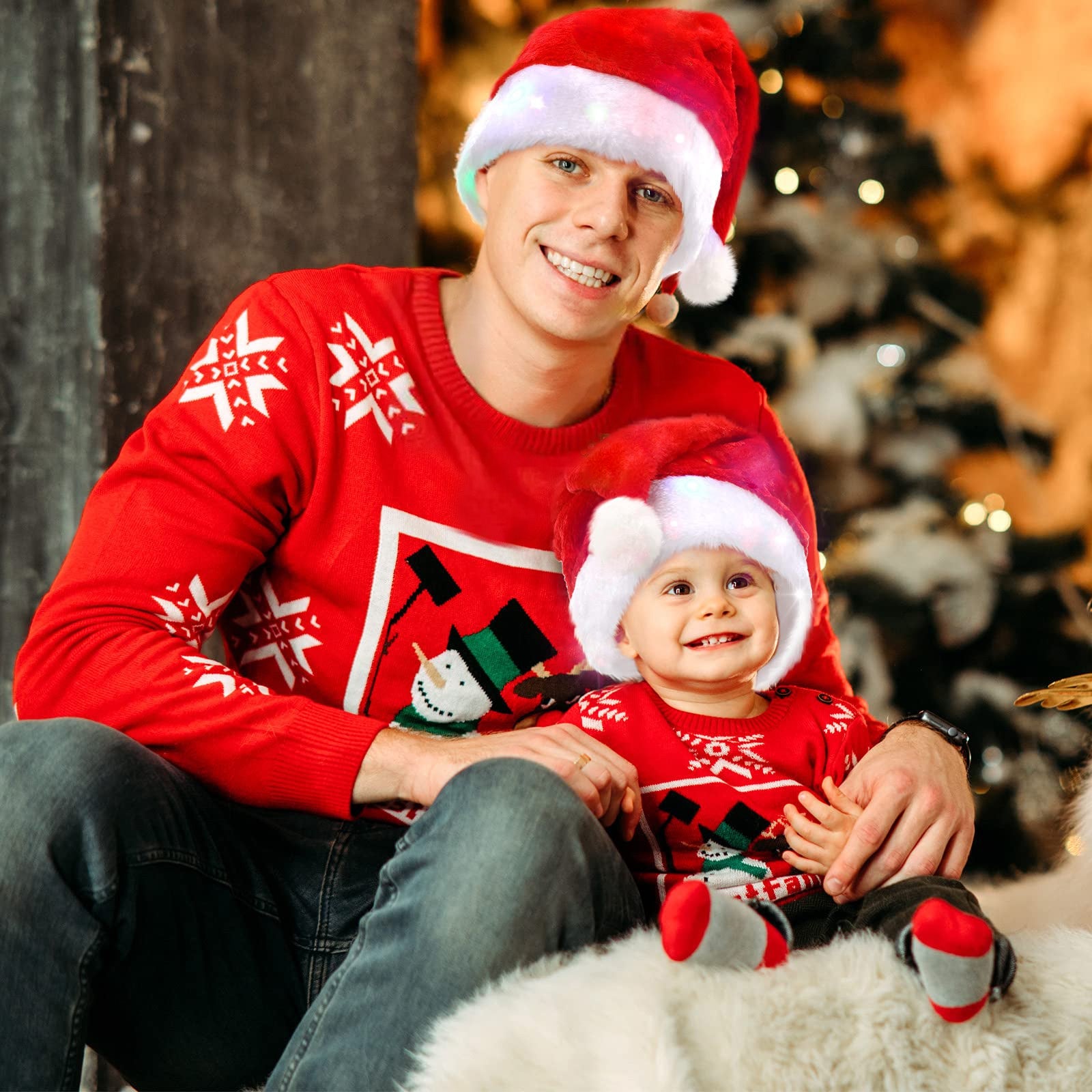 Two adult-sized Christmas Glowing Santa Hats with multicolor LED lights, made of soft plush material, perfect for festive celebrations.