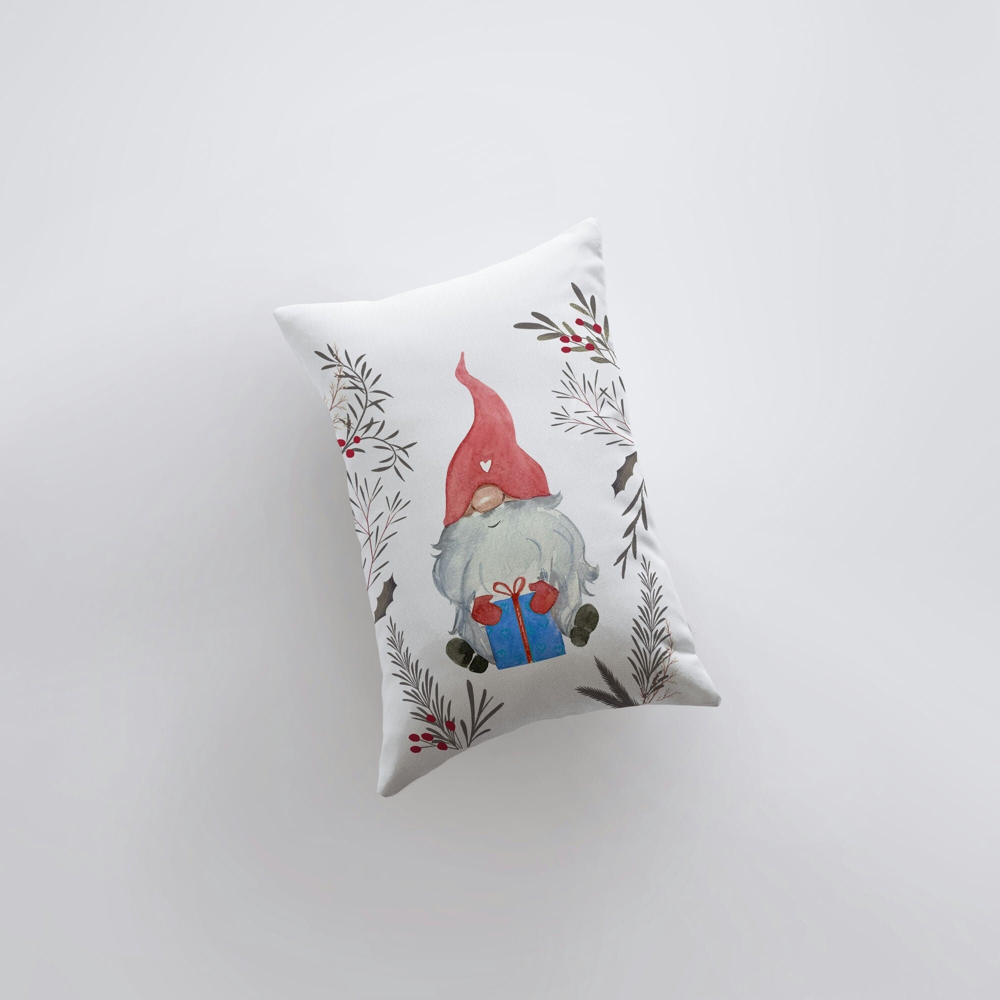 Christmas Gnome throw pillow featuring a watercolor gnome with a red hat surrounded by leaves and berries, perfect for holiday decor.