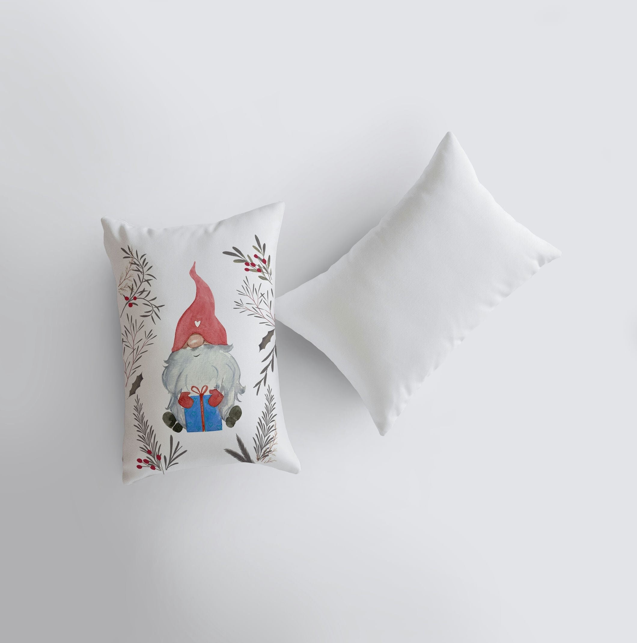 Christmas Gnome throw pillow featuring a watercolor gnome with a red hat surrounded by leaves and berries, perfect for holiday decor.