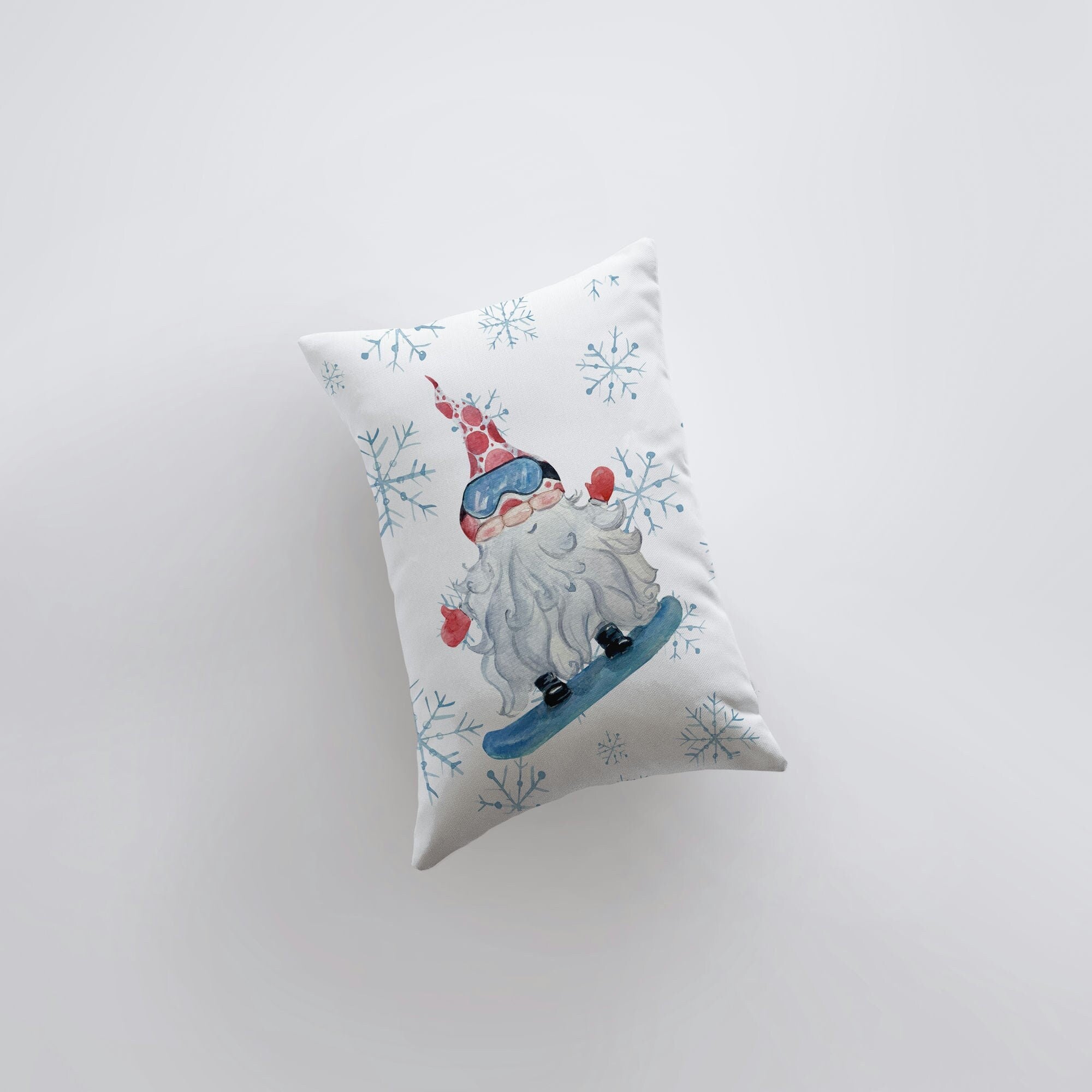 Christmas Gnome Snowboarding throw pillow with snowflakes, hand-made in America, featuring a whimsical gnome design.