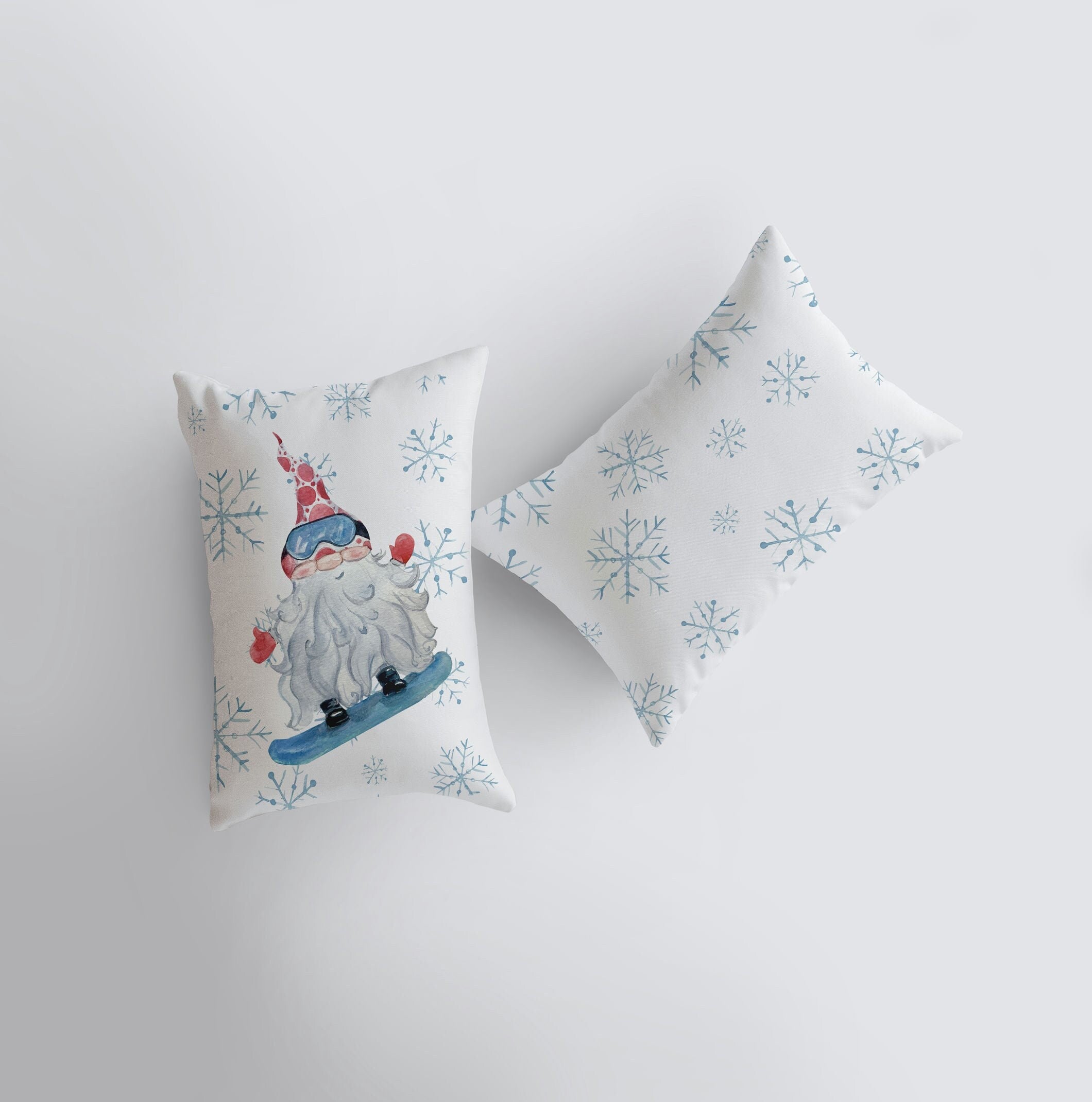 Christmas Gnome Snowboarding throw pillow with snowflakes, hand-made in America, featuring a whimsical gnome design.