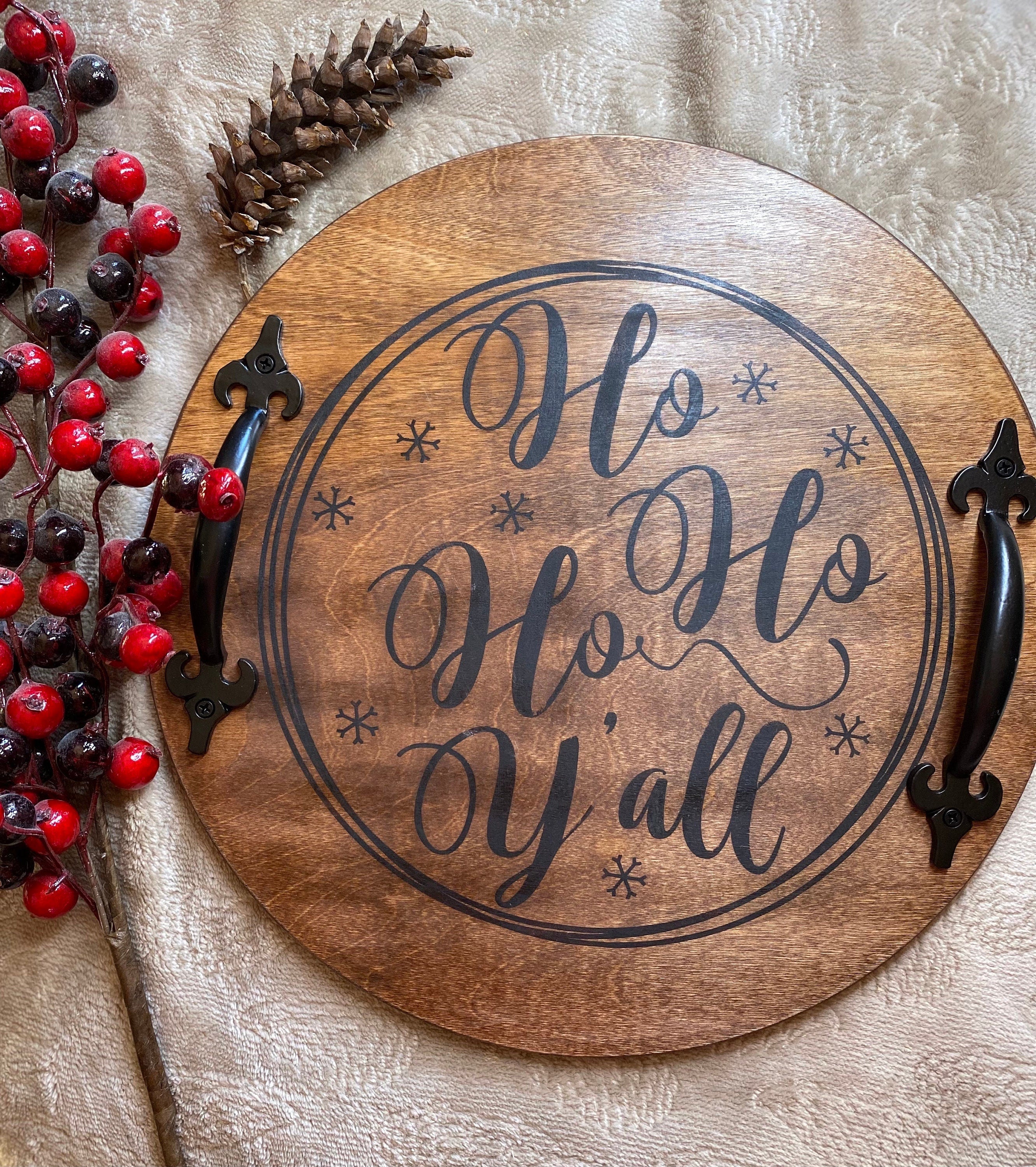 Handmade wooden Christmas serving tray with black metal handles, stained in rich chestnut color, showcasing unique wood grain patterns.