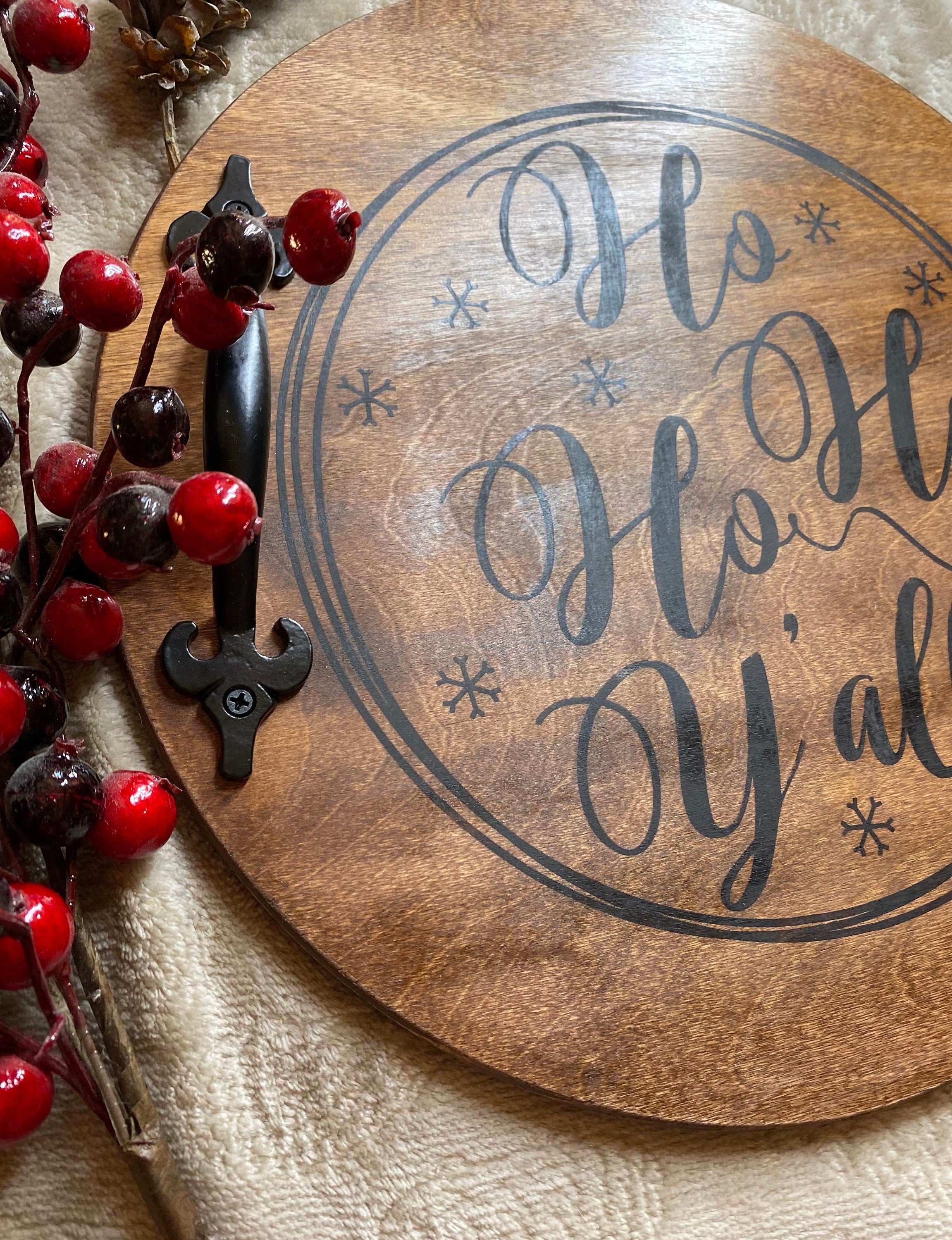 Handmade wooden Christmas serving tray with black metal handles, stained in rich chestnut color, showcasing unique wood grain patterns.