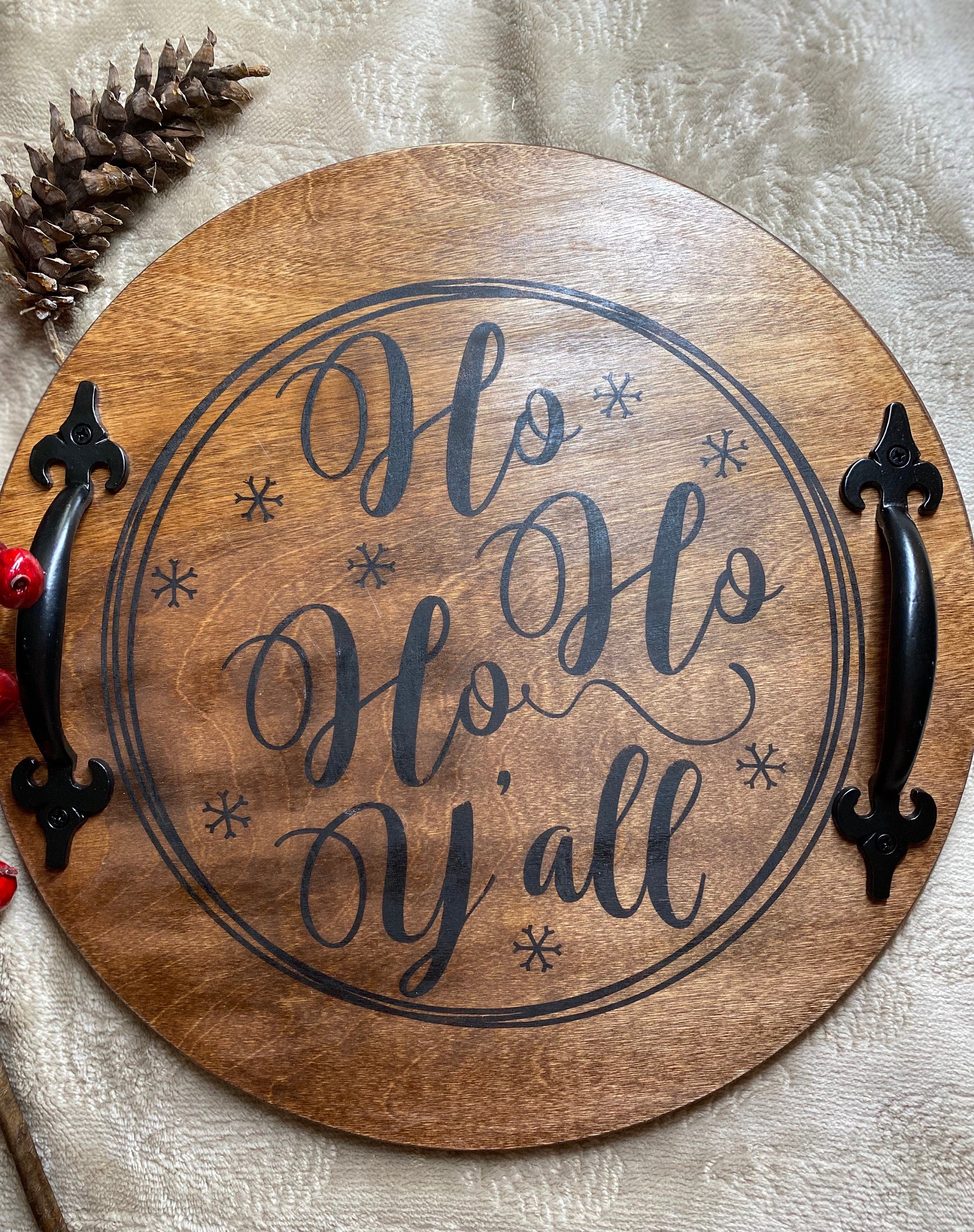 Handmade wooden Christmas serving tray with black metal handles, stained in rich chestnut color, showcasing unique wood grain patterns.