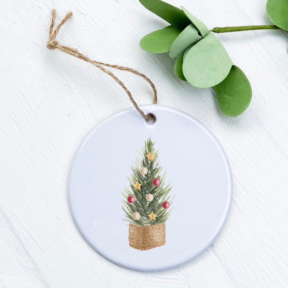 A beautifully crafted porcelain Christmas Tree Basket ornament featuring original designs, perfect for holiday decor.