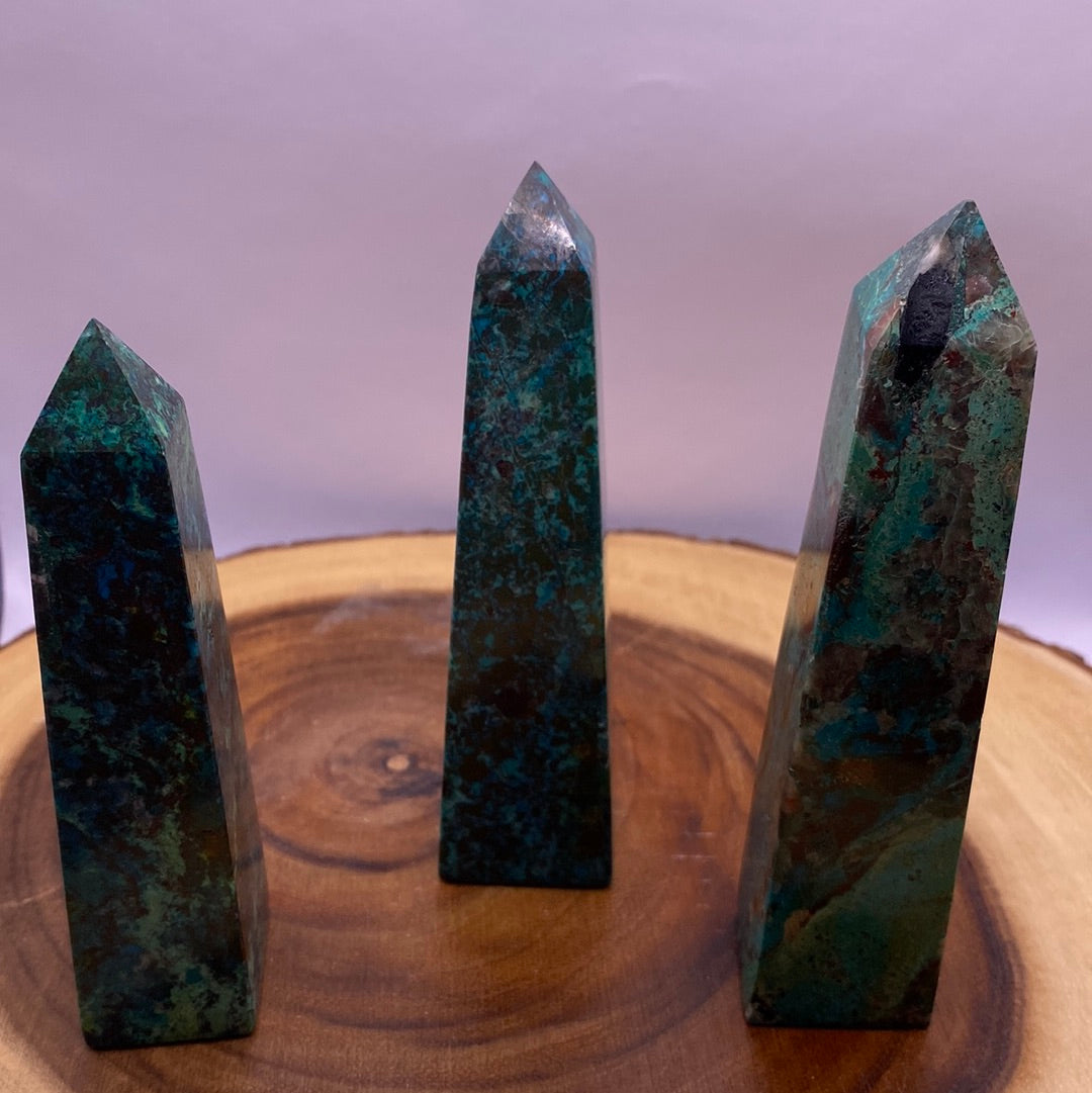 A polished Chrysocolla Obelisk showcasing vibrant teal blue-green colors and unique swirls, perfect for meditation and healing.