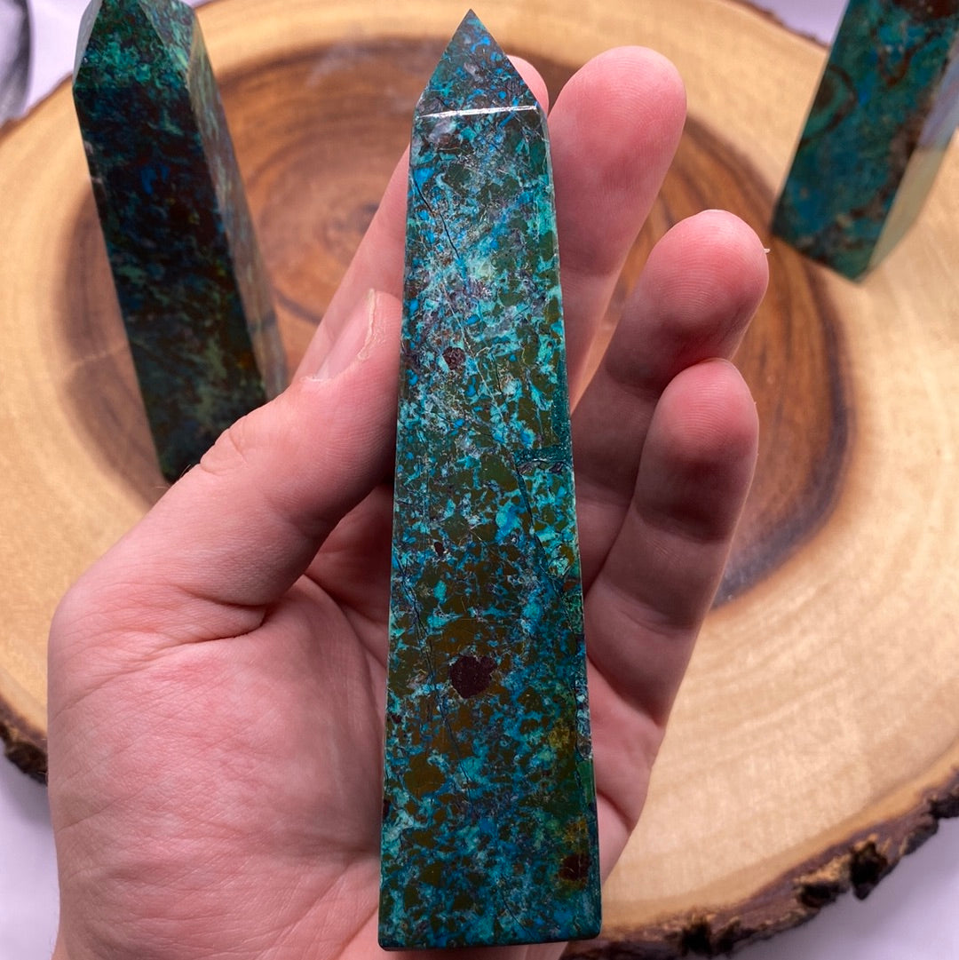 A polished Chrysocolla Obelisk showcasing vibrant teal blue-green colors and unique swirls, perfect for meditation and healing.