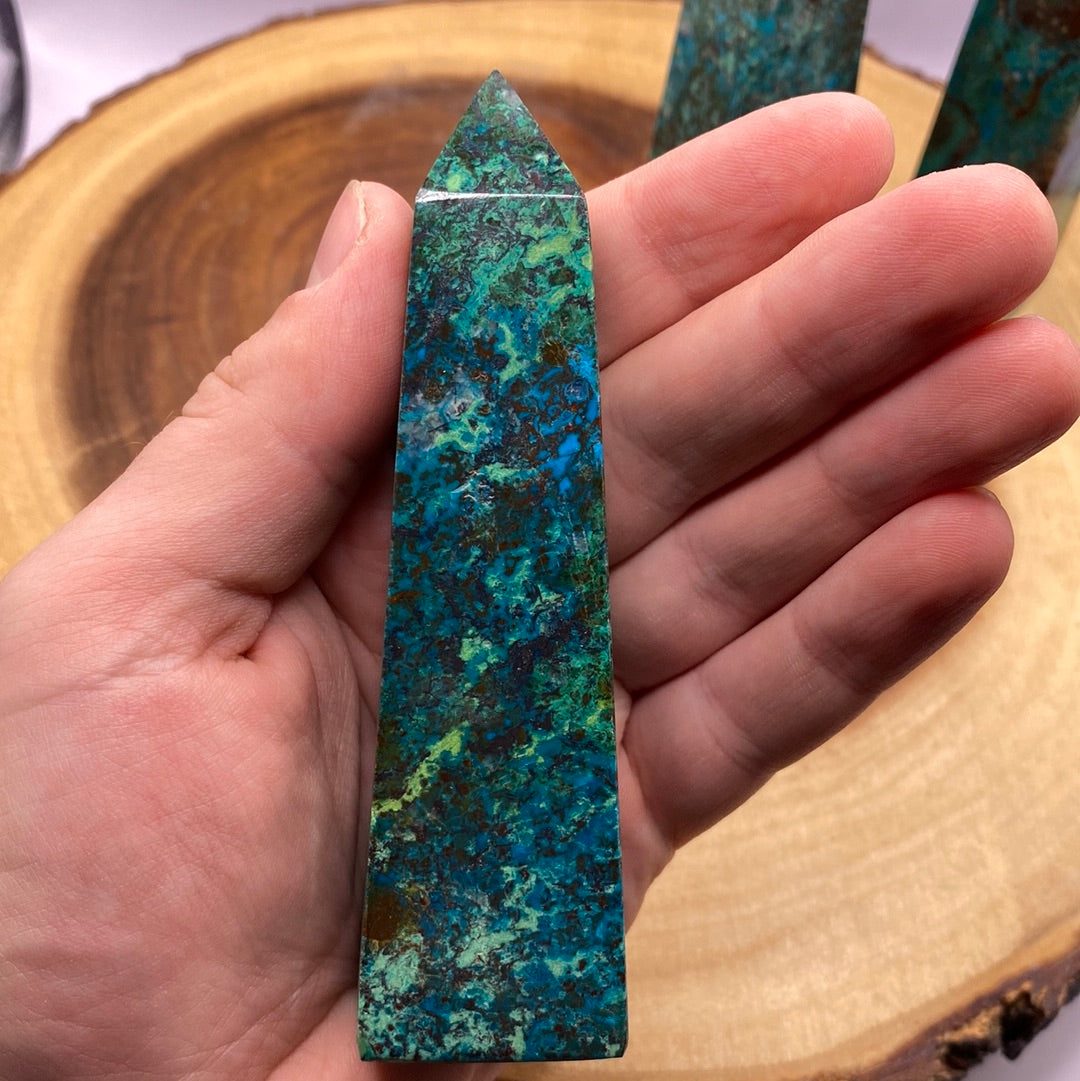 A polished Chrysocolla Obelisk showcasing vibrant teal blue-green colors and unique swirls, perfect for meditation and healing.