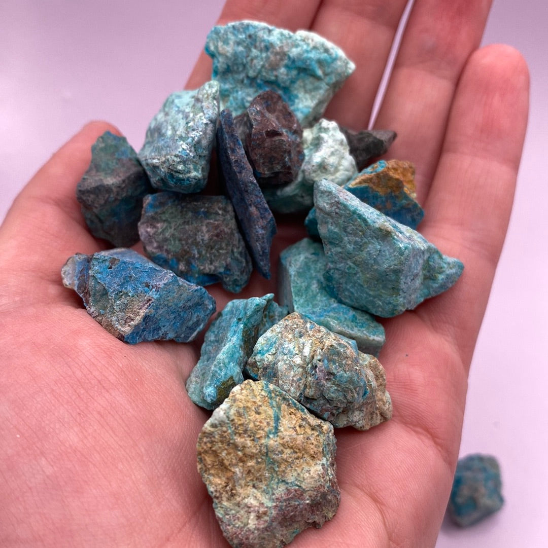 A beautiful rough cut piece of Chrysocolla showcasing its vibrant blue and green hues, symbolizing harmony and emotional healing.