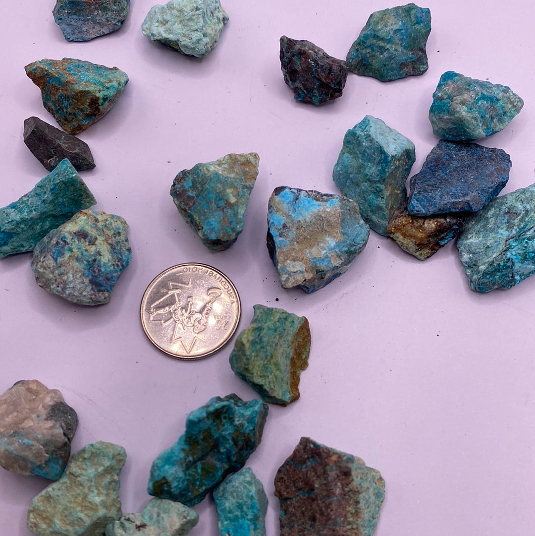 A beautiful rough cut piece of Chrysocolla showcasing its vibrant blue and green hues, symbolizing harmony and emotional healing.