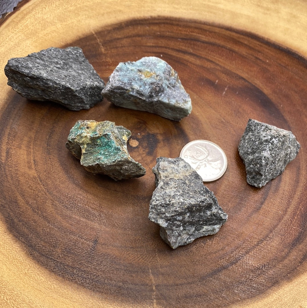 A rough cut piece of Chrysocolla showcasing deep blue-green hues, perfect for meditation and spiritual healing.