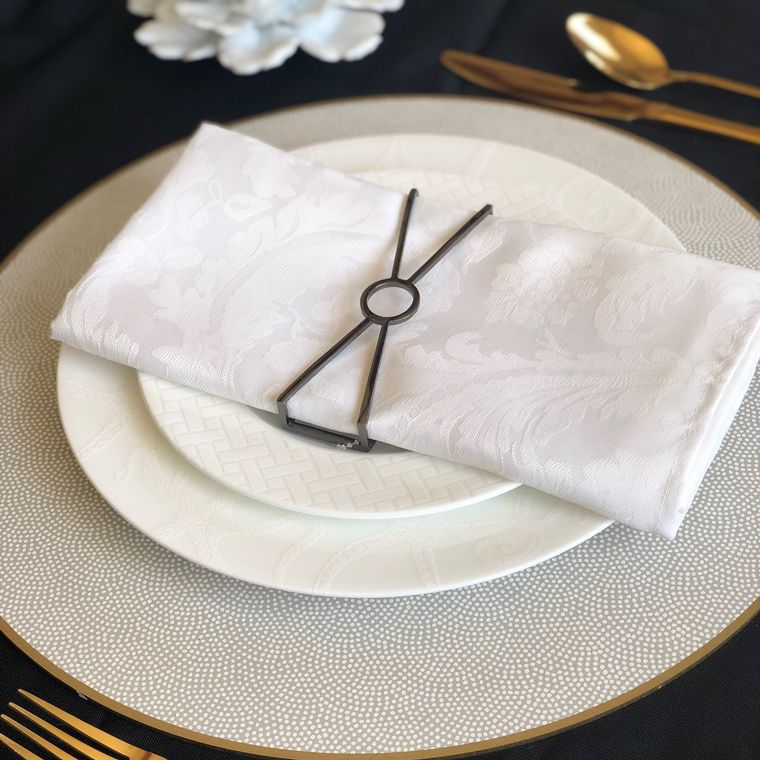 Circle X Wrap Set in Matte Charcoal, featuring four stylish napkin wraps designed for elegant dining.