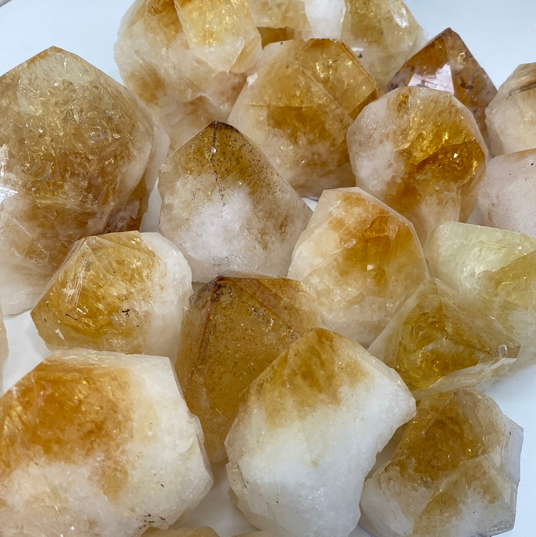 High-quality Citrine Cut Base Top Polished Points showcasing unique shapes and vibrant colors, perfect for energy healing.