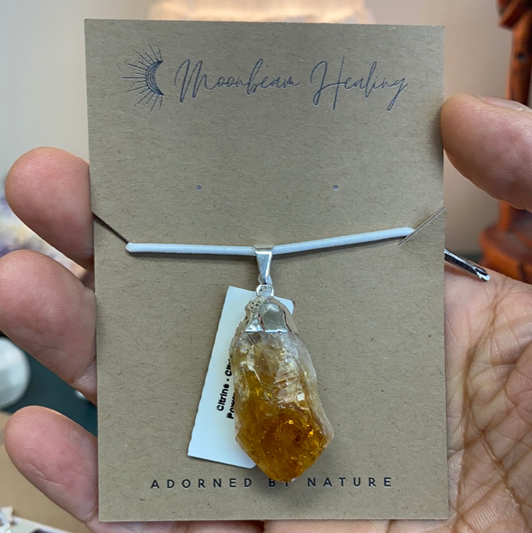 A stunning Citrine Rough Cut Pendant featuring natural citrine points with a silver coating, showcasing its vibrant yellow to orange hues.