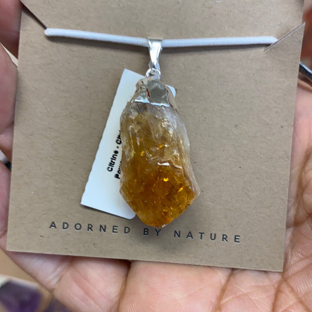 A stunning Citrine Rough Cut Pendant featuring natural citrine points with a silver coating, showcasing its vibrant yellow to orange hues.