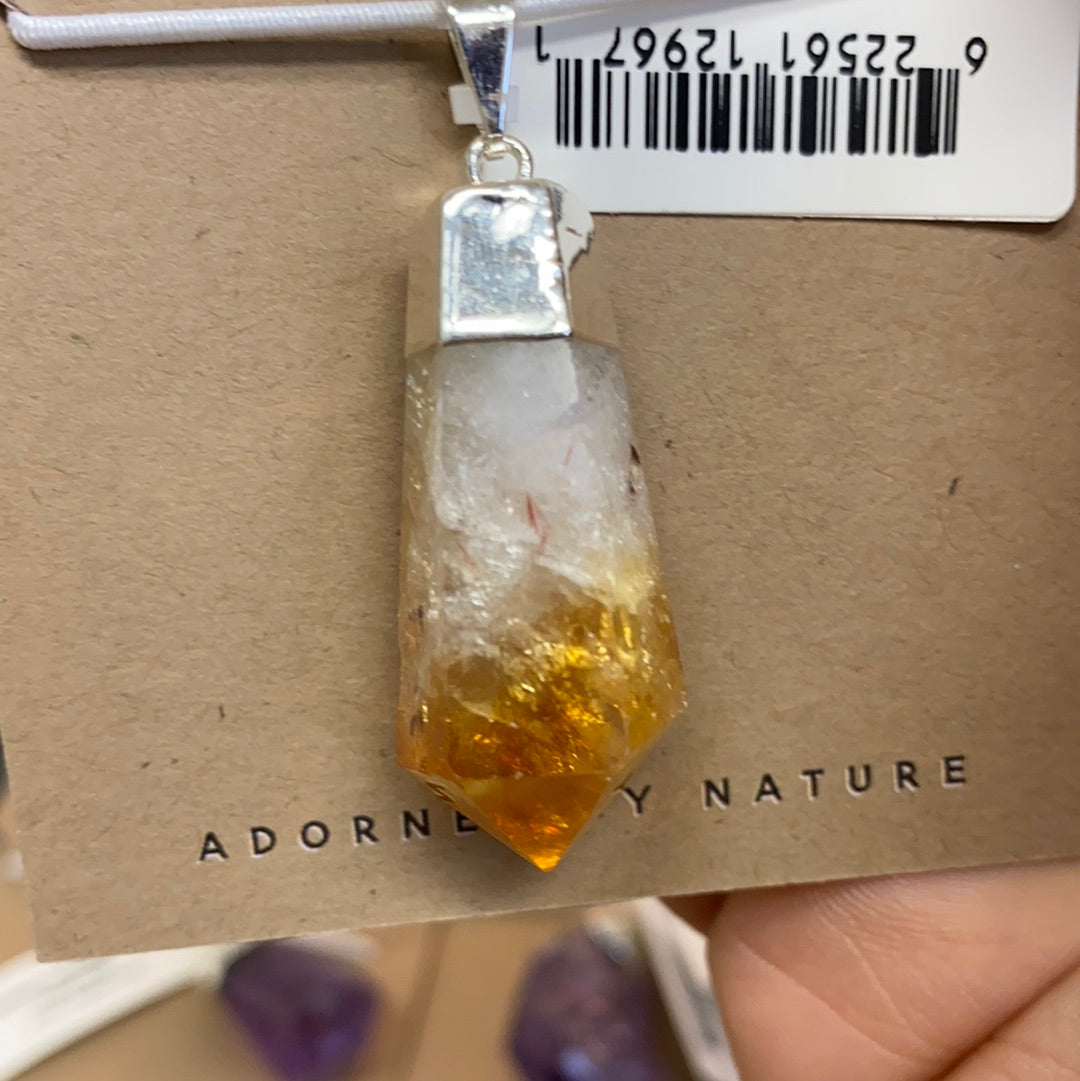 Citrine Teardrop Faceted Pendant showcasing a vibrant yellow to brown color gradient, elegantly shaped in a teardrop design.