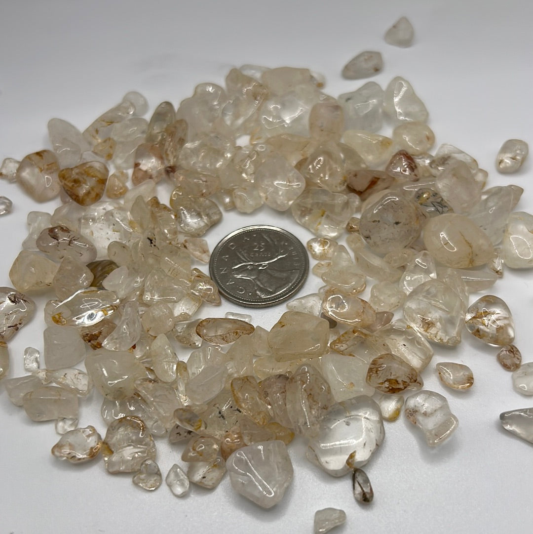 A close-up view of Clear Quartz Crystal Chips, showcasing their transparent and reflective qualities, ideal for healing and meditation.