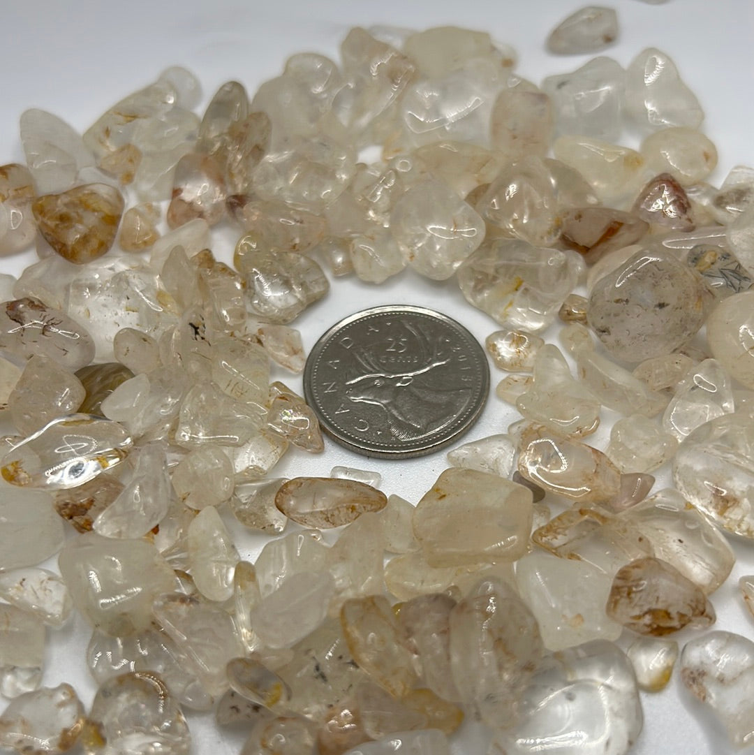 A close-up view of Clear Quartz Crystal Chips, showcasing their transparent and reflective qualities, ideal for healing and meditation.