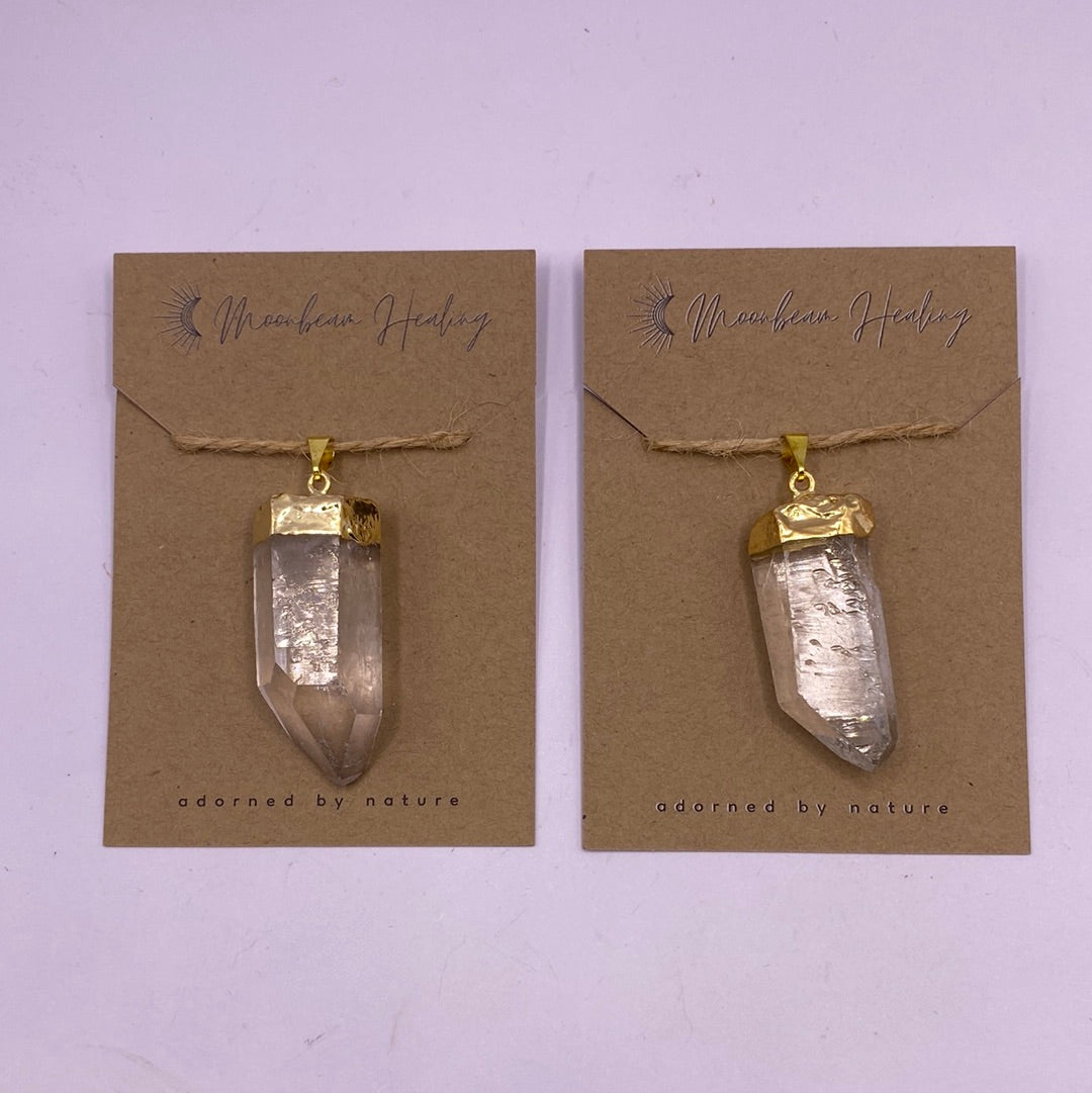 Clear Quartz Rough Cut Pendant with Gold Electro-Plating, showcasing its sparkling clarity and unique rough texture.