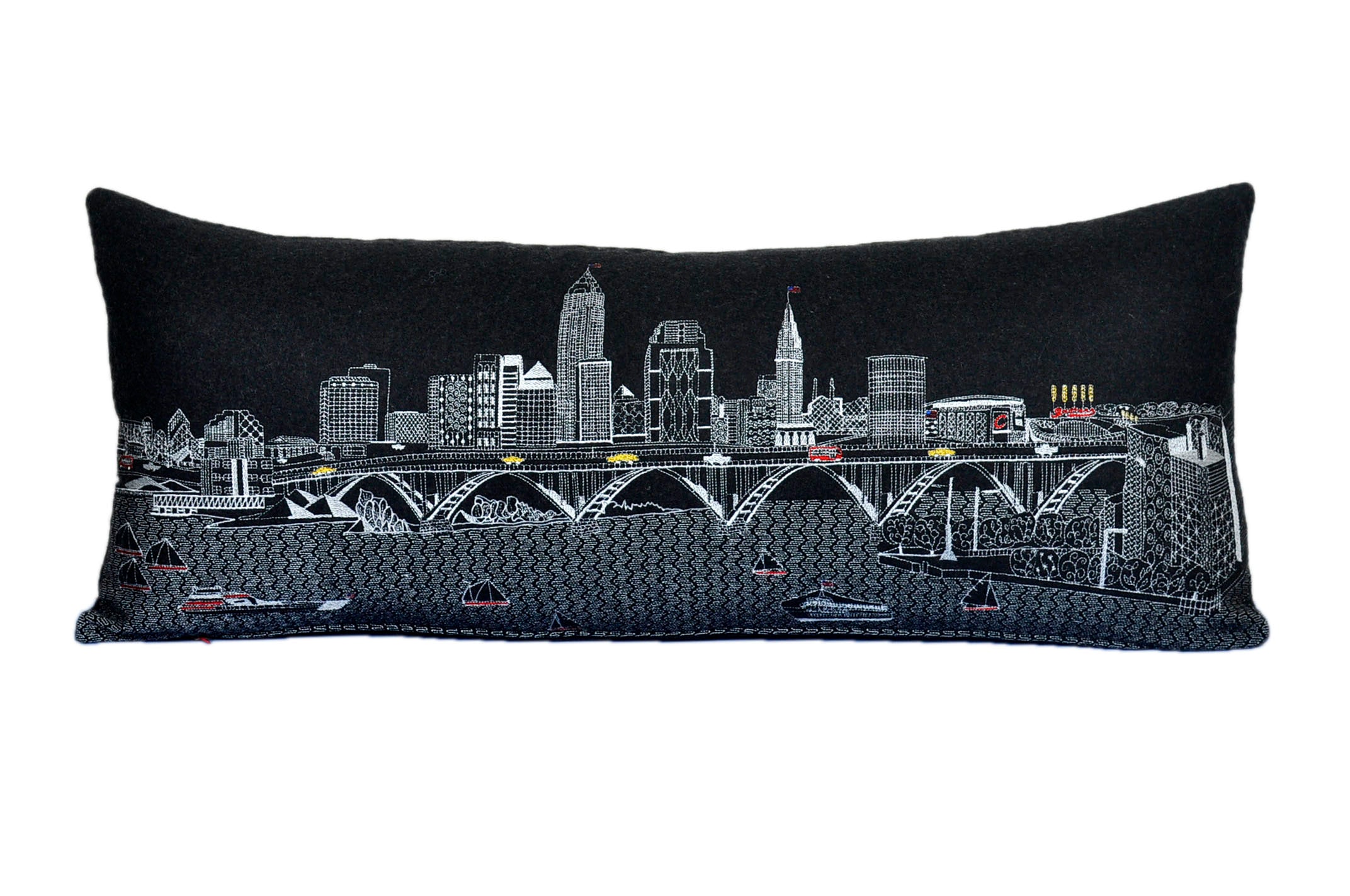 Cleveland Pillow featuring the city's skyline with vibrant colors and a red zipper at the bottom.