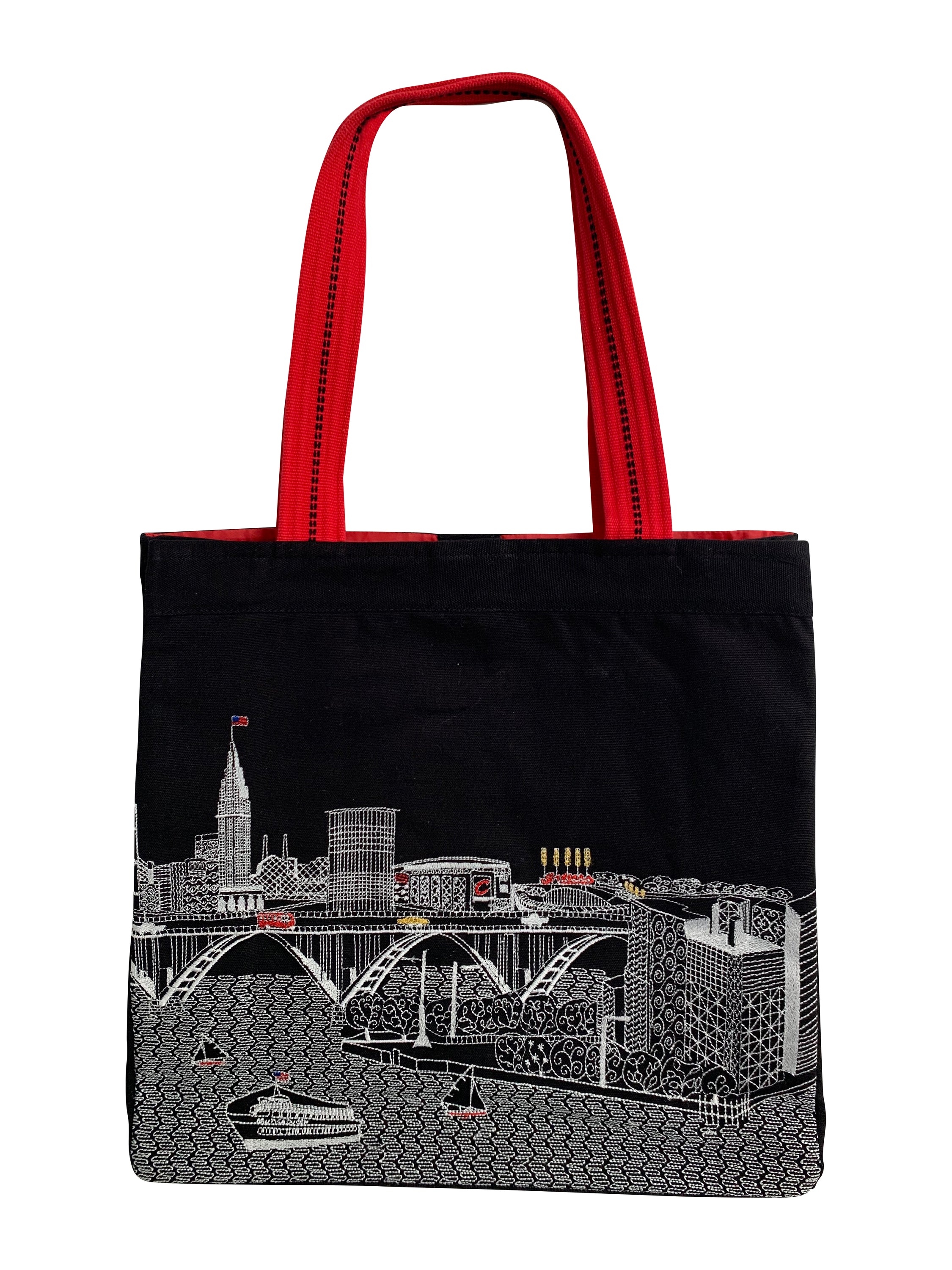 Cleveland Tote Bag featuring an embroidered skyline design on cream and black cotton canvas with red waterproof lining and ribbed straps.