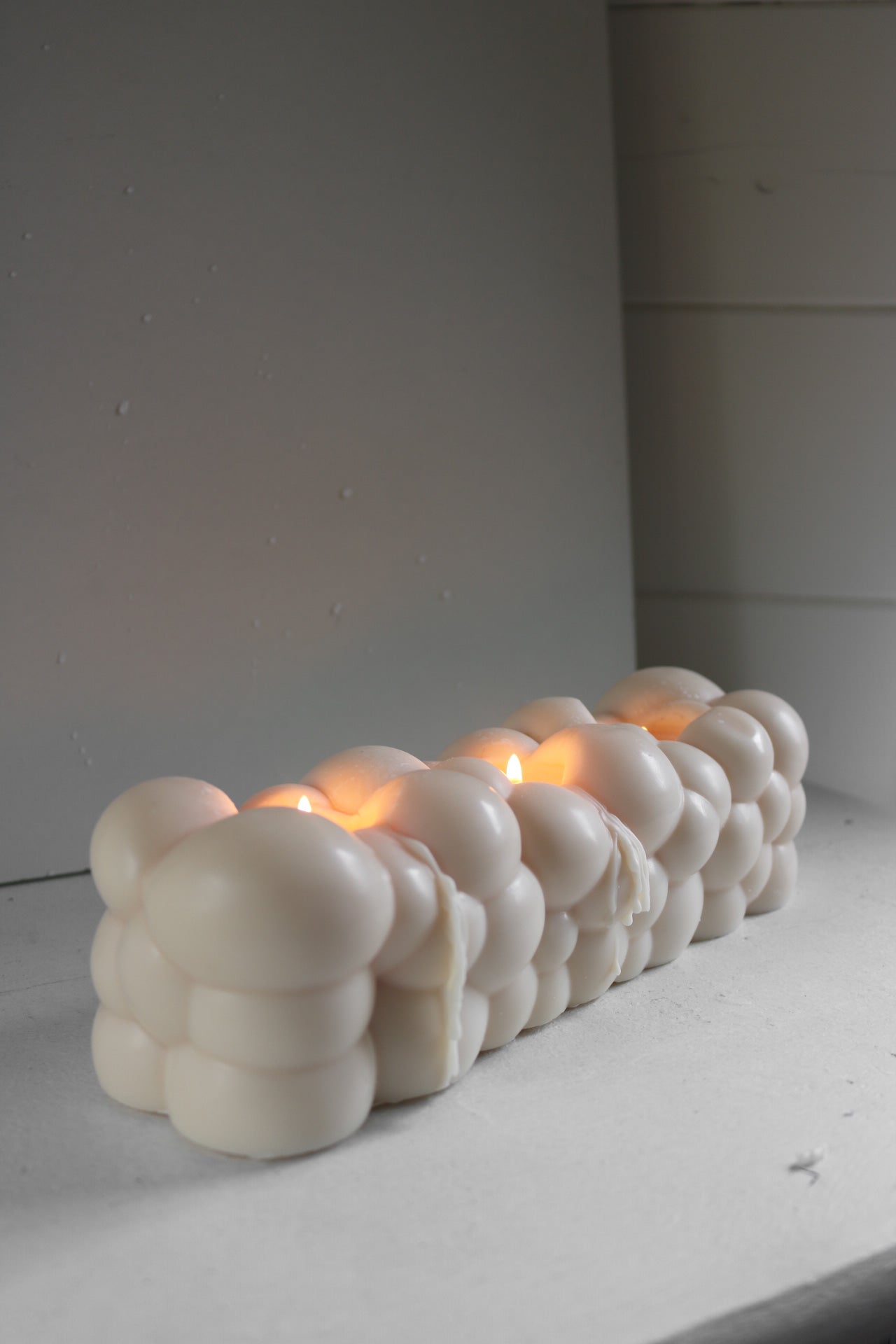 Cloud Nine candle, a sculptural decorative piece made from a soy wax blend, showcasing its elegant design and dimensions.