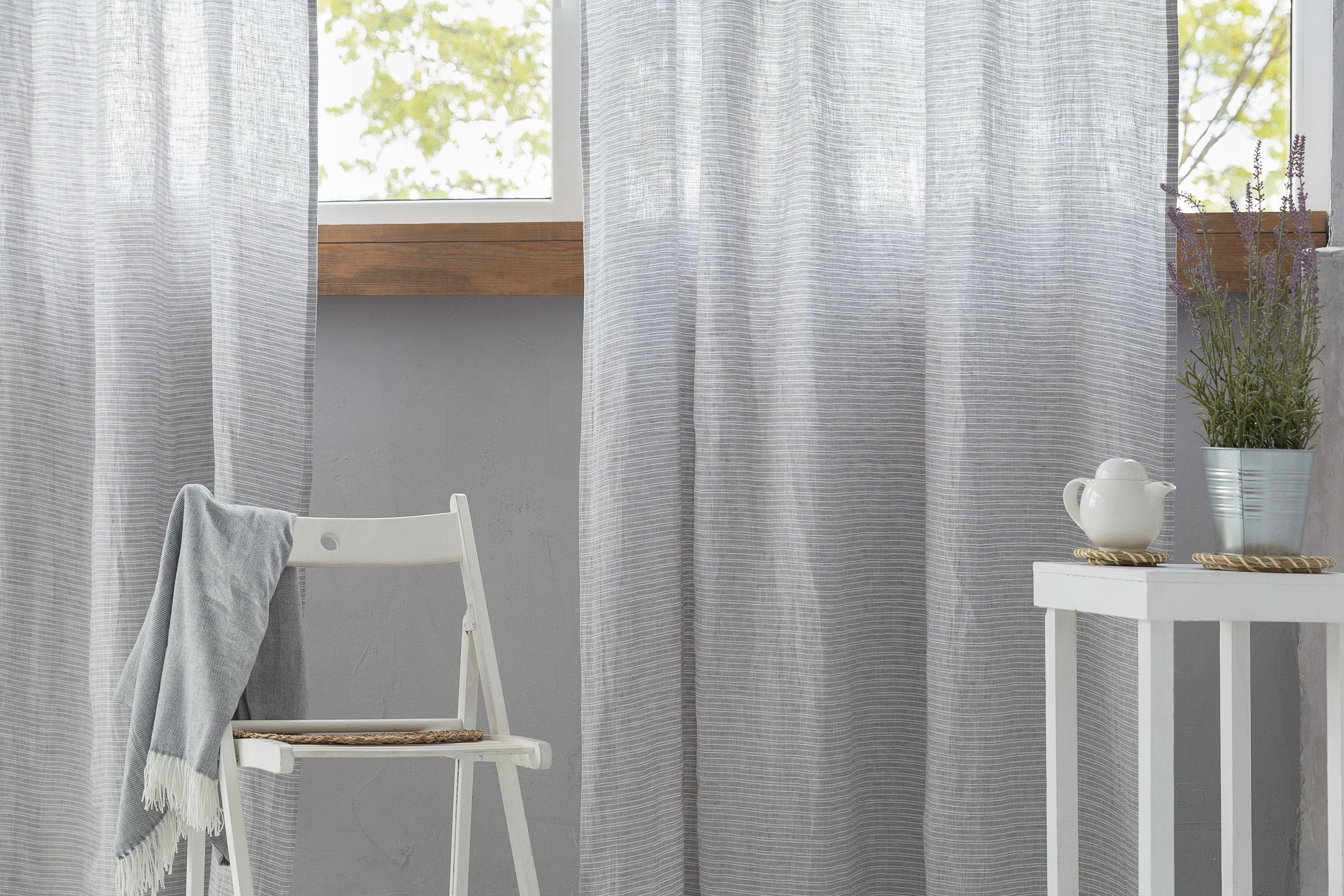 Cloudy Grey Stripe linen curtain with pleating tape and crown, showcasing elegant design and natural fabric texture.