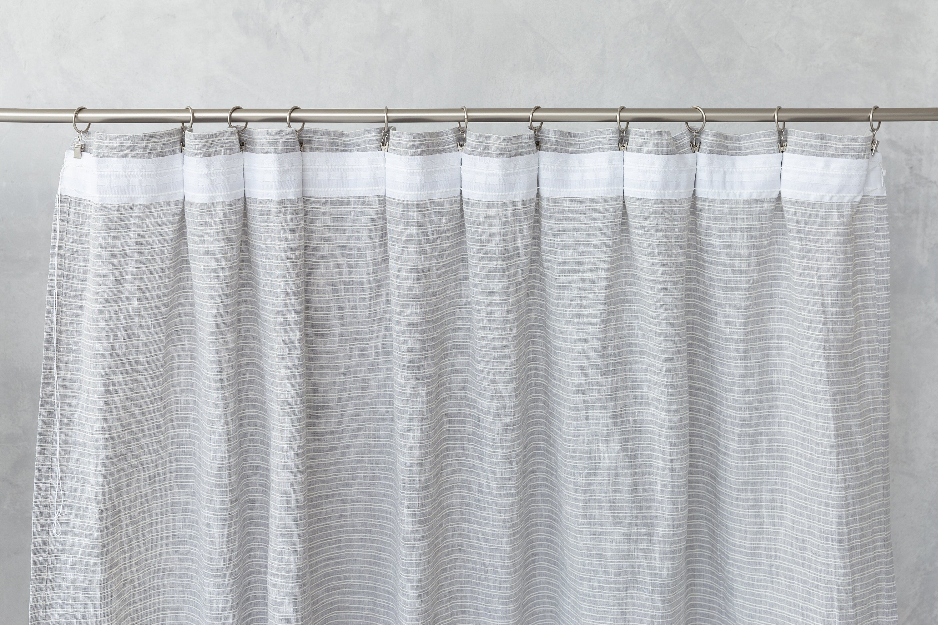 Cloudy Grey Stripe linen curtain with pleating tape and crown, showcasing elegant design and natural fabric texture.