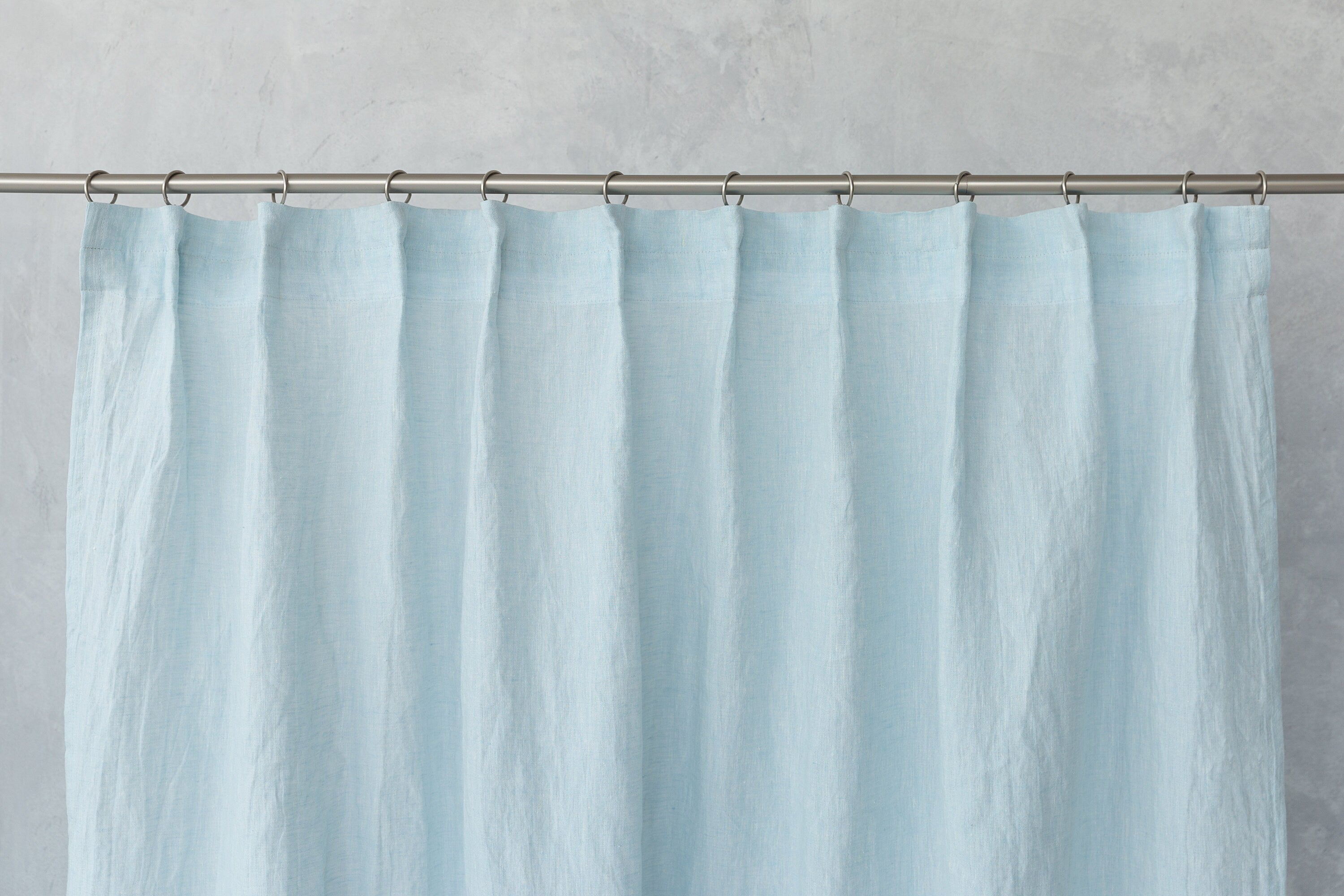 Cloudy Grey Stripe linen curtain with pleating tape and crown, showcasing elegant design and natural fabric texture.